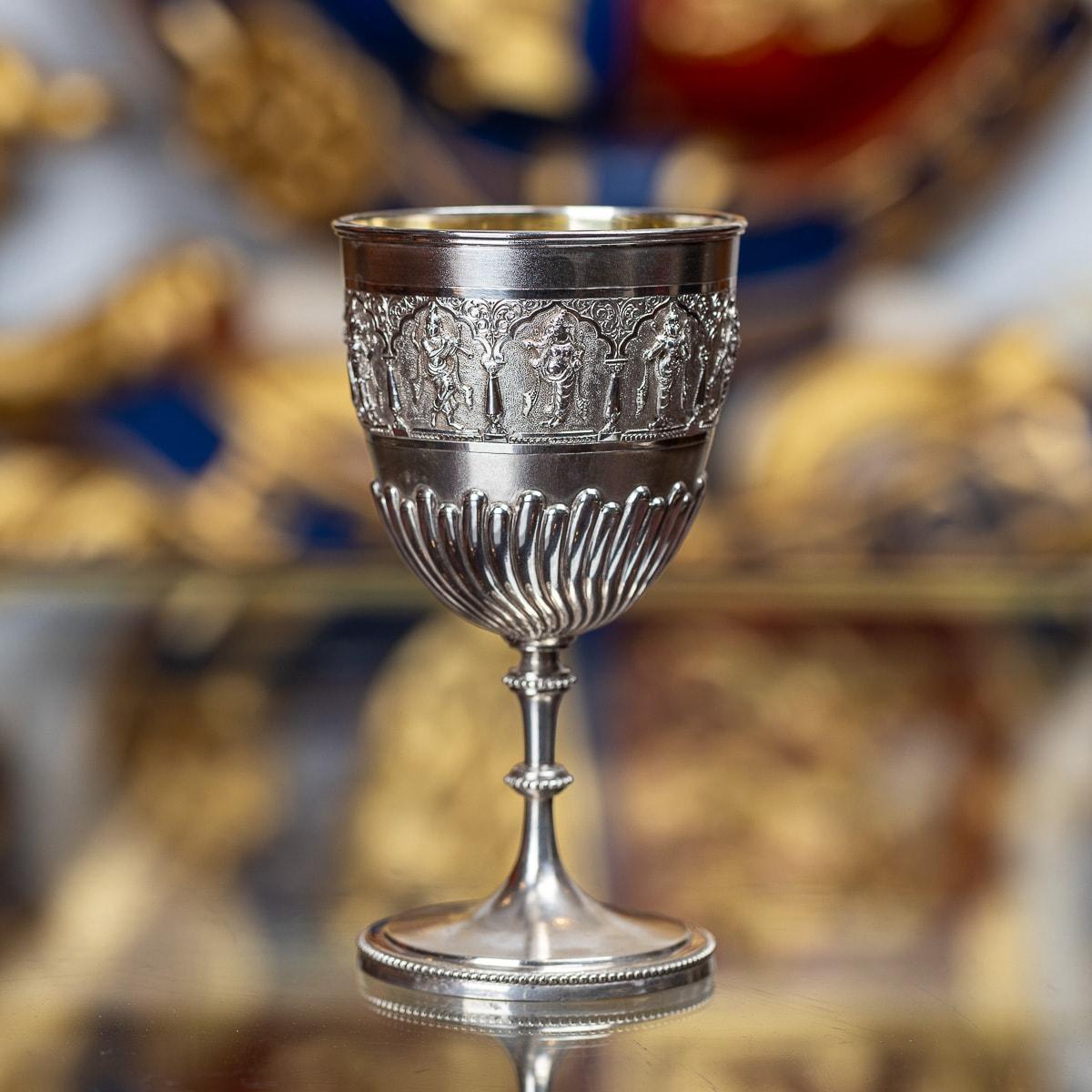 Antique late-19th Century Indian Colonial solid silver repousse goblet, the top band is beautifully chased and repousse' decorated depicting Hindu gods and goddesses in elaborate cartooches, applied with beaded boarders and flutted decoration.