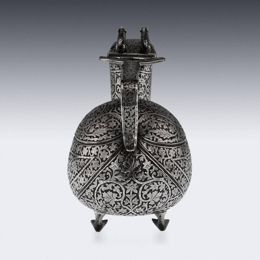 Antique 19th century Indian solid silver zoomorphic silver lidded jug, of very unusual shape which is partially based on the classical Askos jug, native to ancient Greece. Standing on four cast and chased bird feet, the neck, body and handle are