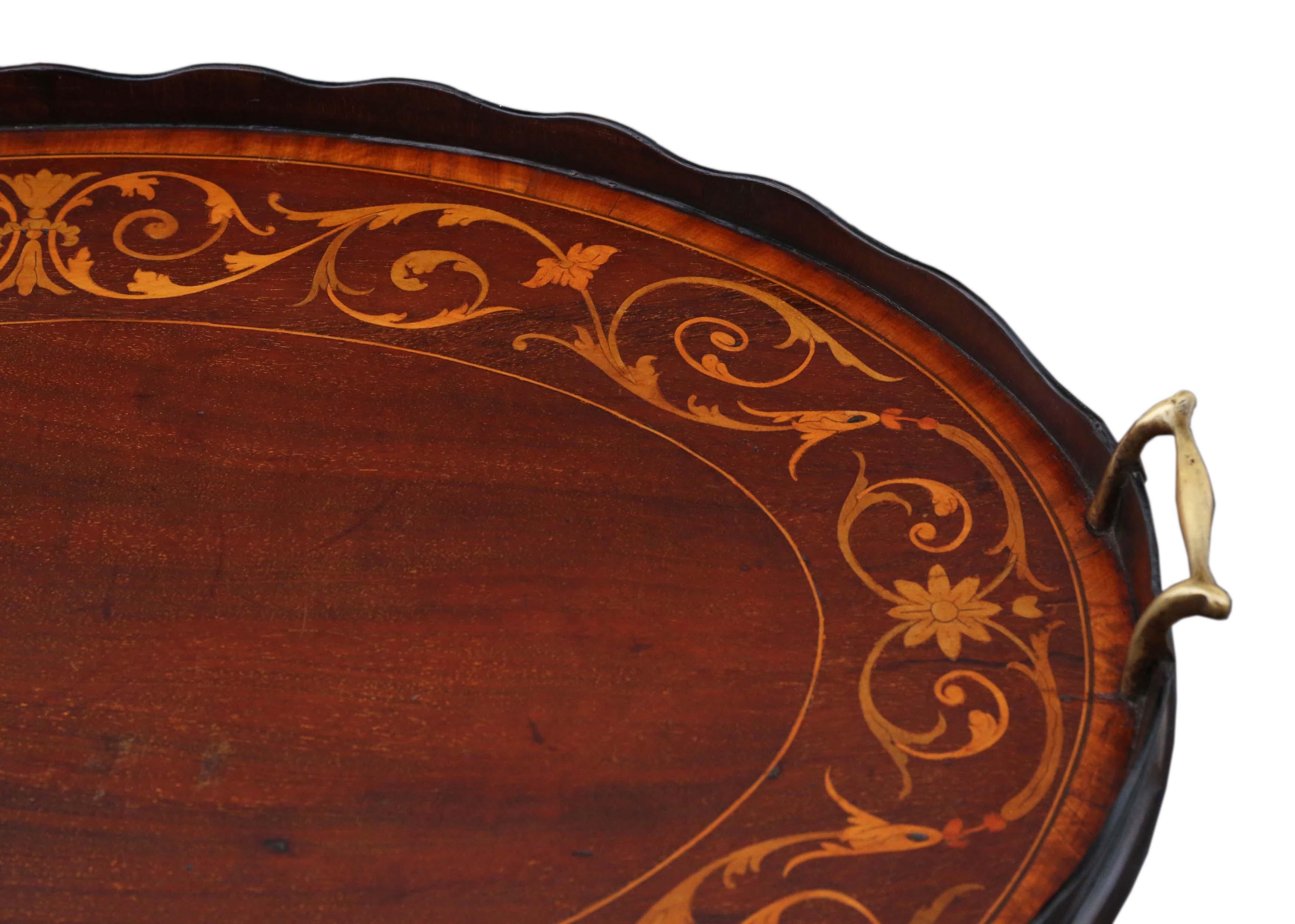 Antique quality 19th century inlaid mahogany oval serving tea tray.

A great quality tray with brass handles... one of the best examples that we have seen.

Very attractive, with lovely proportions and styling.

Desirable oval shape, with