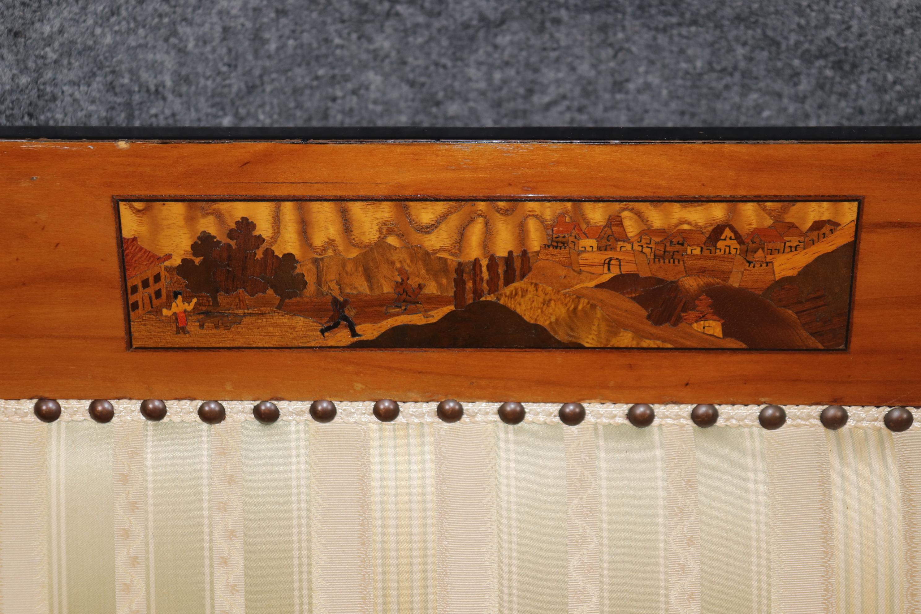 This is a very rare form of Austro-German Biedermeier style of inlaid settee. The inlaid areas show pattera and pastoral scenes of the countryside. The settee will show wear to the upholstery as is clearly shown and the frame will also show wear as