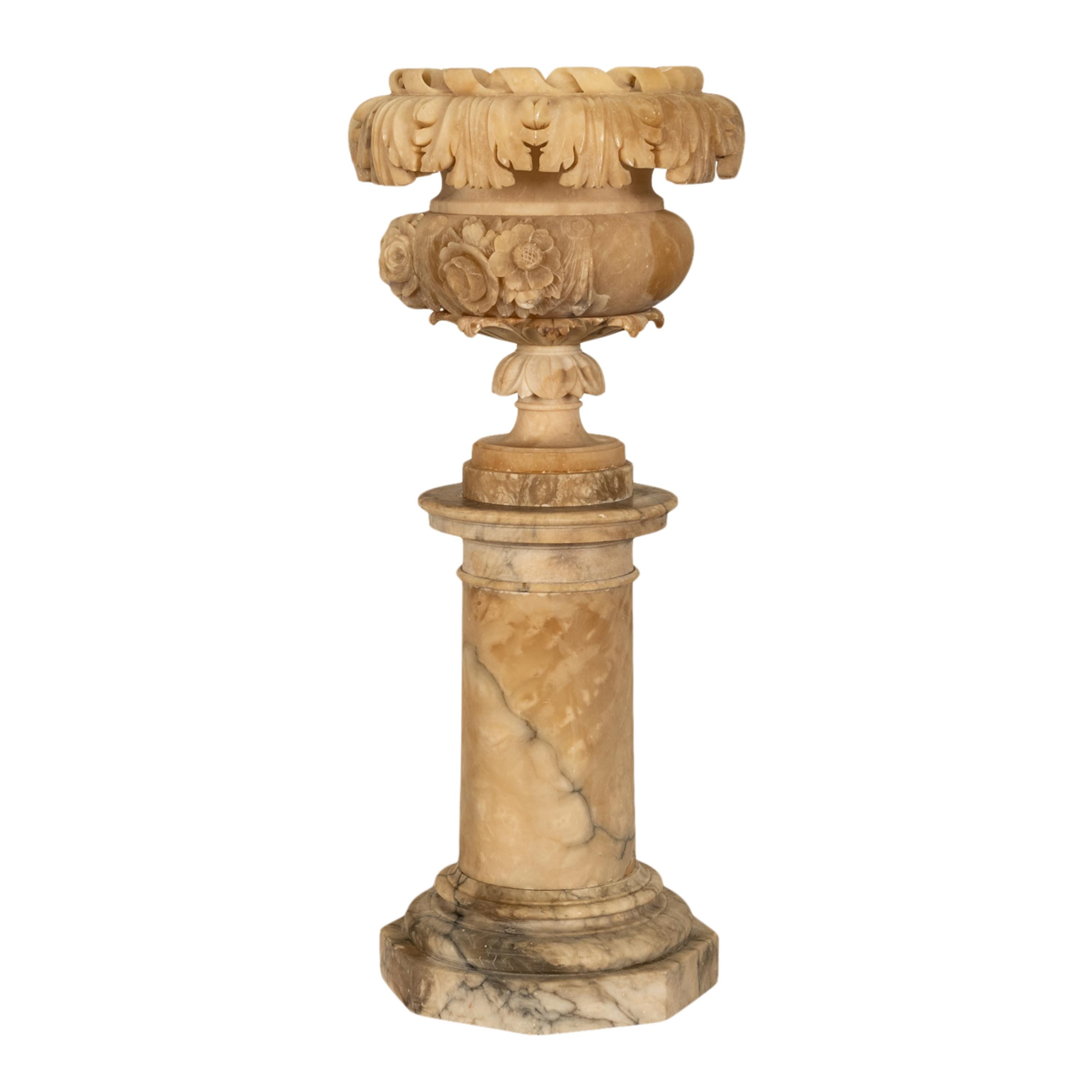 A large & substantial antique Italian Neoclassical carved alabaster urn on pedestal, circa 1850.
The urn is made of the finest variegated & veined alabaster, the campagna shaped urn with a pronounced 'rope twist' rim and a garland of carved acanthus