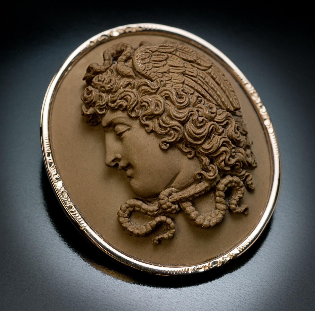Circa 1860

An antique Italian lava cameo is superbly carved in high relief with a powerful depiction of mythological Medusa Gorgon.

The cameo is set in a 14K gold frame and mounted as a brooch.

Size 43 x 36 mm (1 11/16 x 1 7/16 in.)