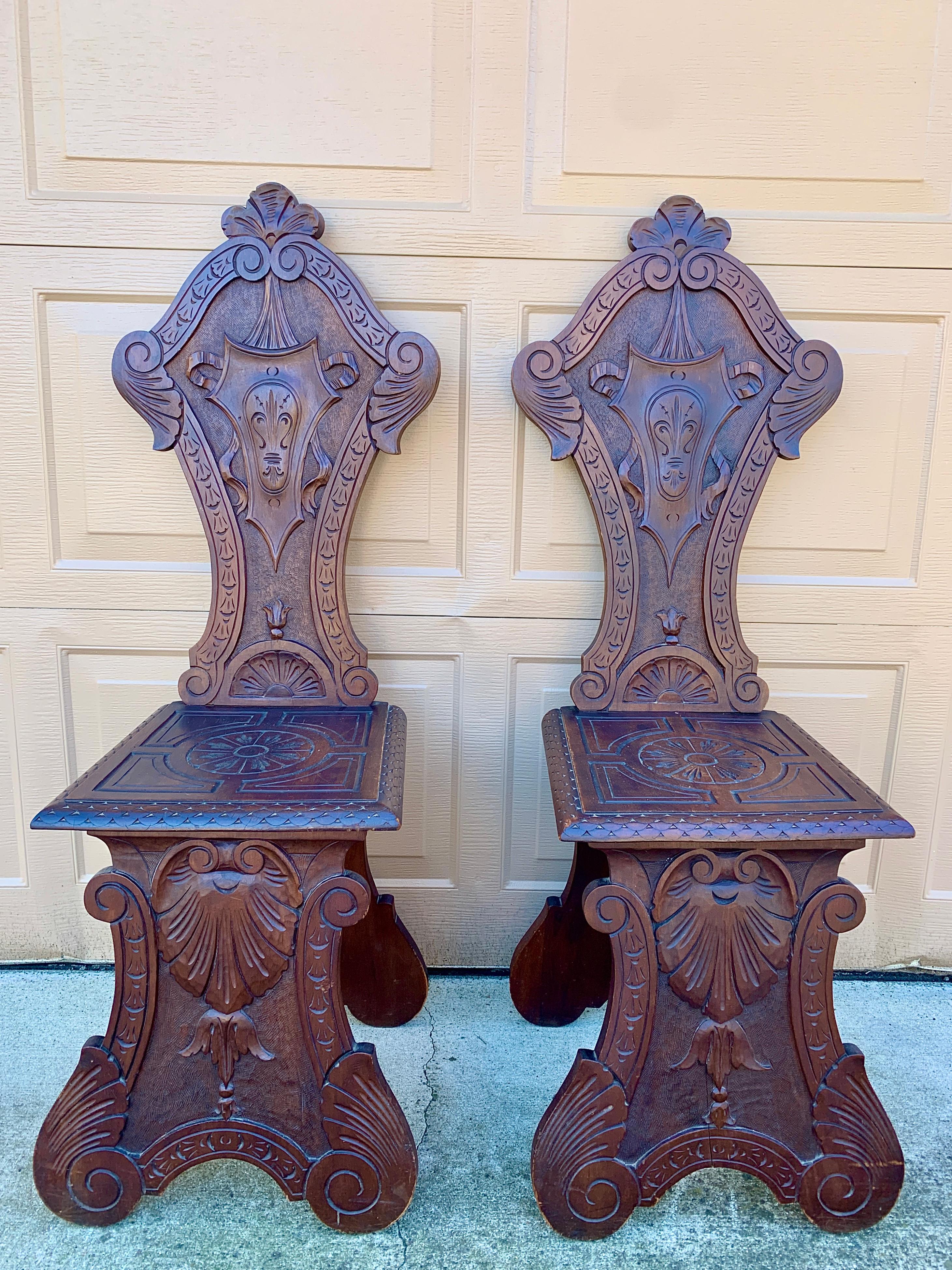 Renaissance Revival Antique 19th Century Italian Renaissance Hand Carved Walnut Hall Chairs, Pair For Sale