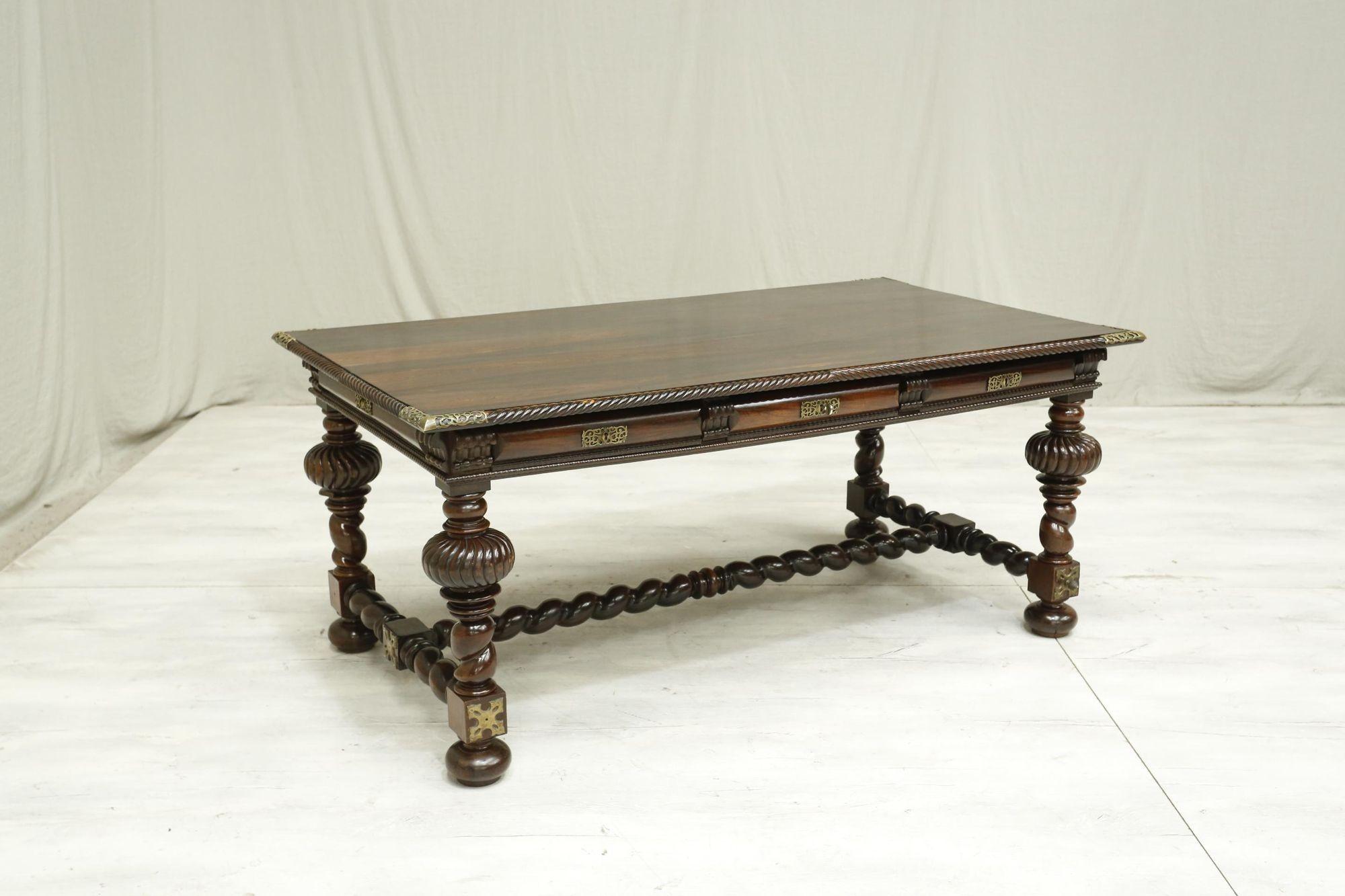 This is a truly exceptional quality 19th century solid Rosewood desk. It is Portuguese in origin and has a striking design that will give the piece a real presence in any room. The Rosewood has incredible figuring and the fact is it solid timber