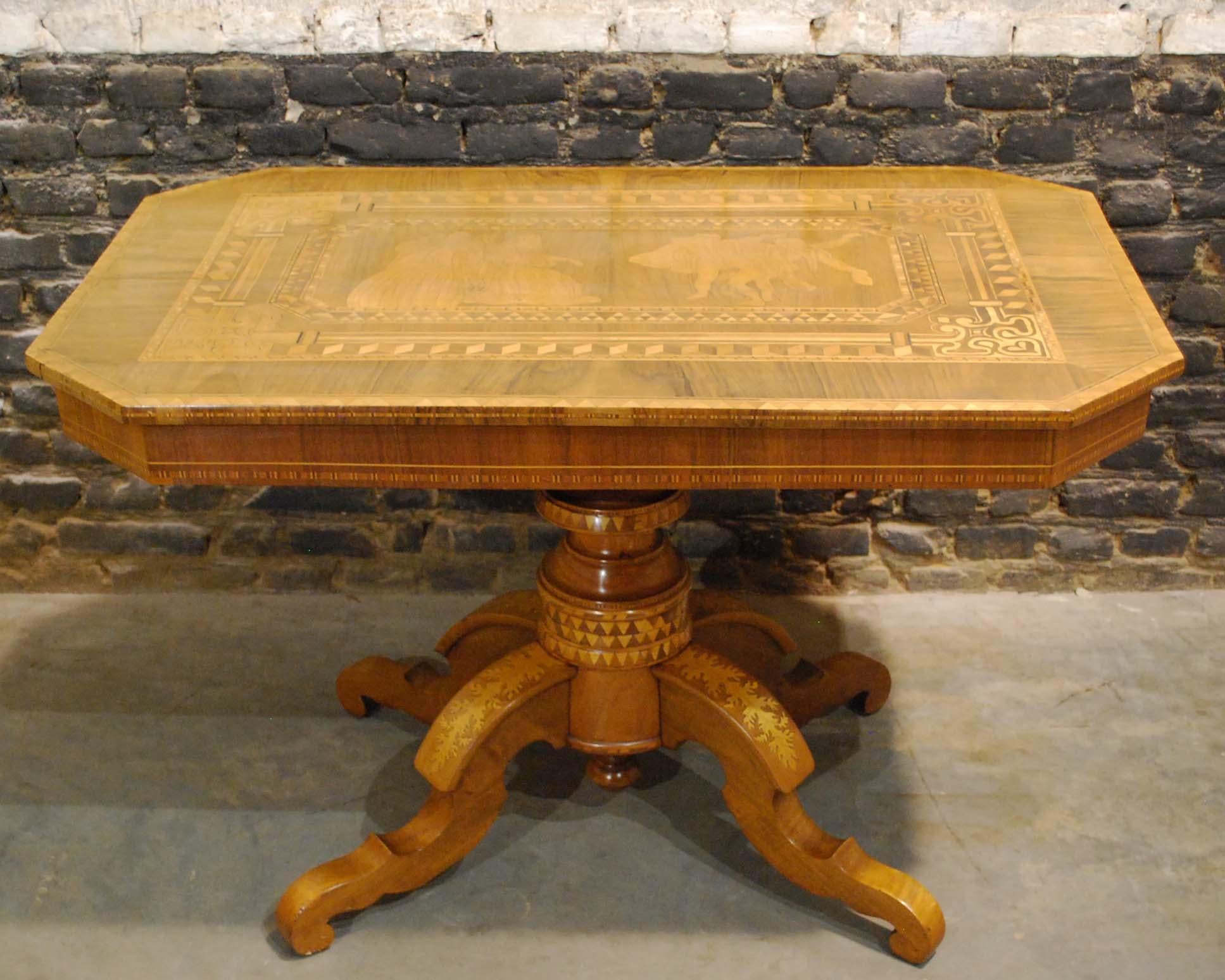 A wonderful heavily decorated tilt-top table made in Italy, circa 1870.
The table has a rectangular top with chamfered corners. It features a central picture from a Shakespeare scene in Marquetry. The scene is Act V, scene 2 from Hamlet: The point