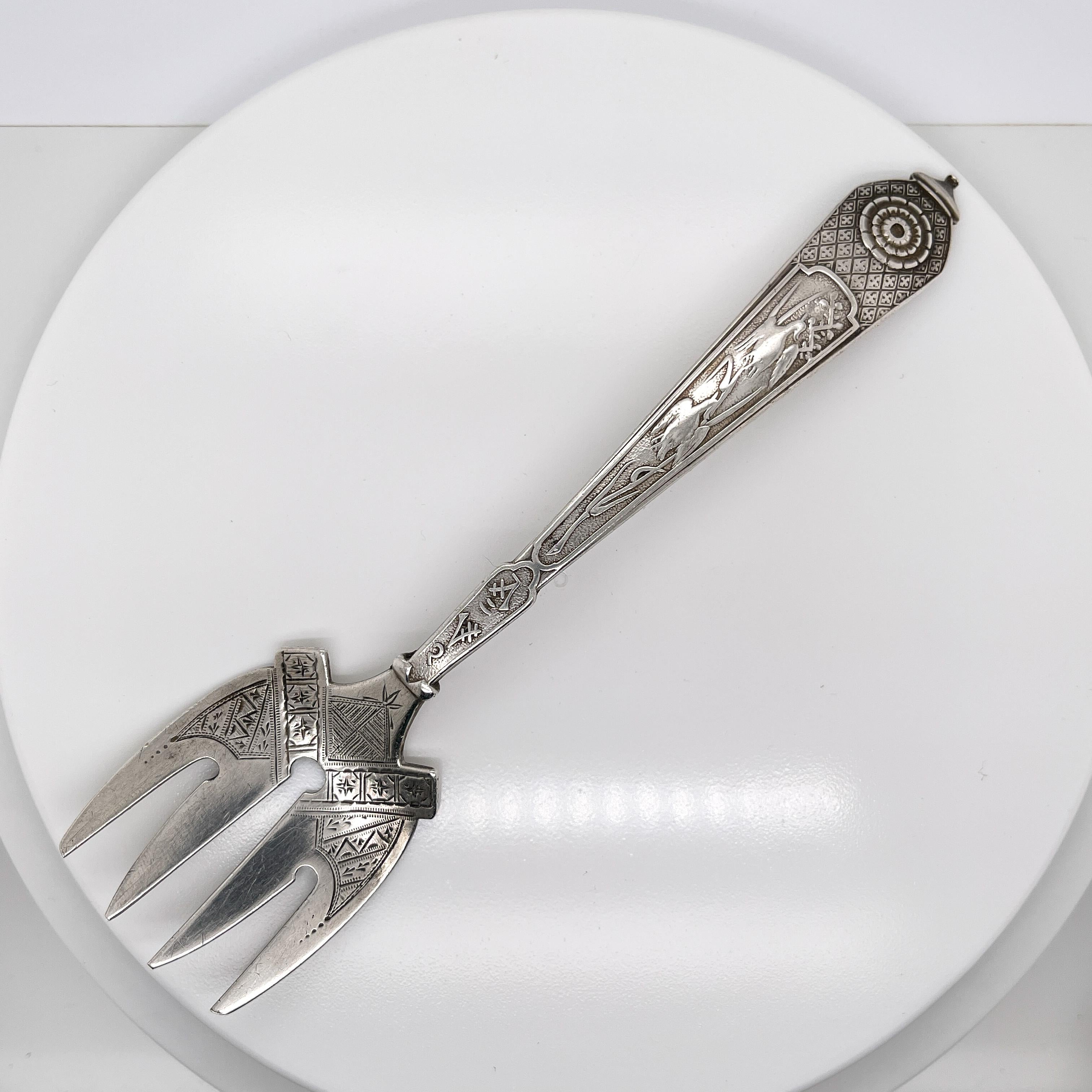 A fine antique sterling silver sardine fork.

By Gorham.

In the Japanese pattern. 

Simply a great sardine fork!

Date:
19th Century

Overall Condition:
It is in overall good, as-pictured, used estate condition.

Condition Details:
The reverse