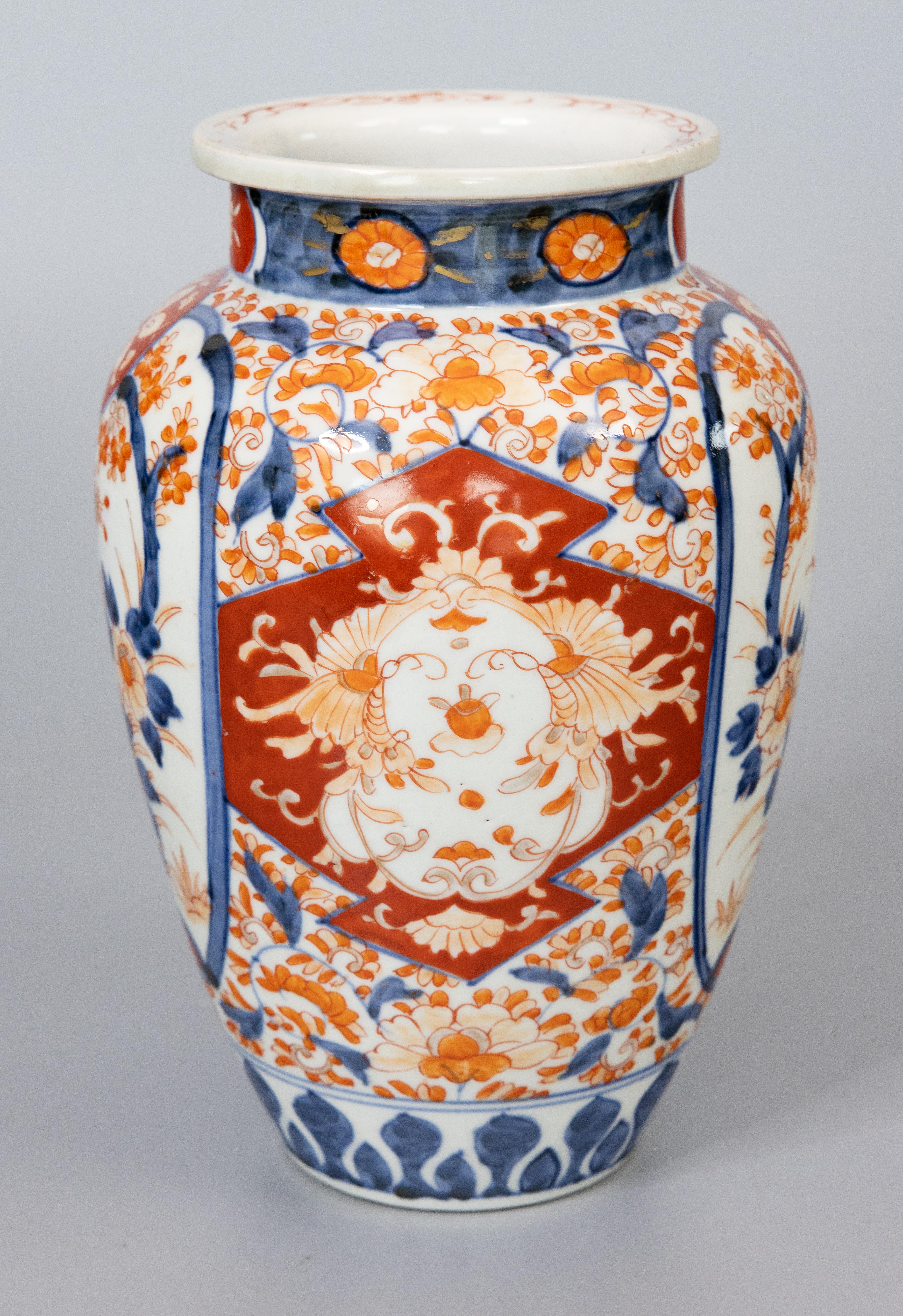 A gorgeous antique 19th-Century Japanese Imari porcelain vase. This fine vase is a nice large size and has a lovely shape and hand painted floral design in the traditional Imari colors. It's in beautiful antique condition and would be fabulous for