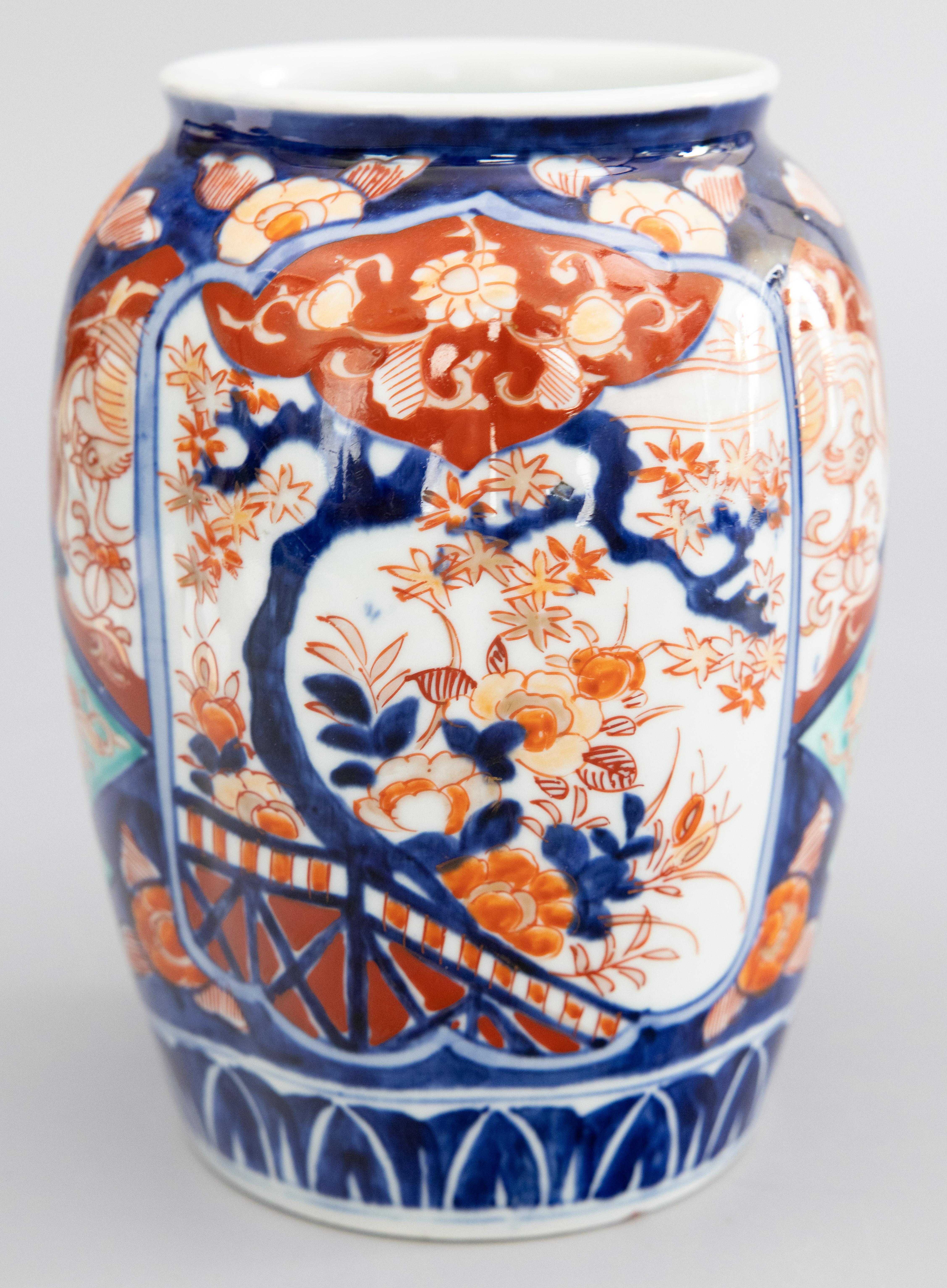 A gorgeous antique 19th-Century Japanese Imari vase made in the Meiji period, circa 1870. This fine vase has a lovely lobed shape and hand painted floral design in the traditional Imari colors with stunning turquoise accents. It's in beautiful
