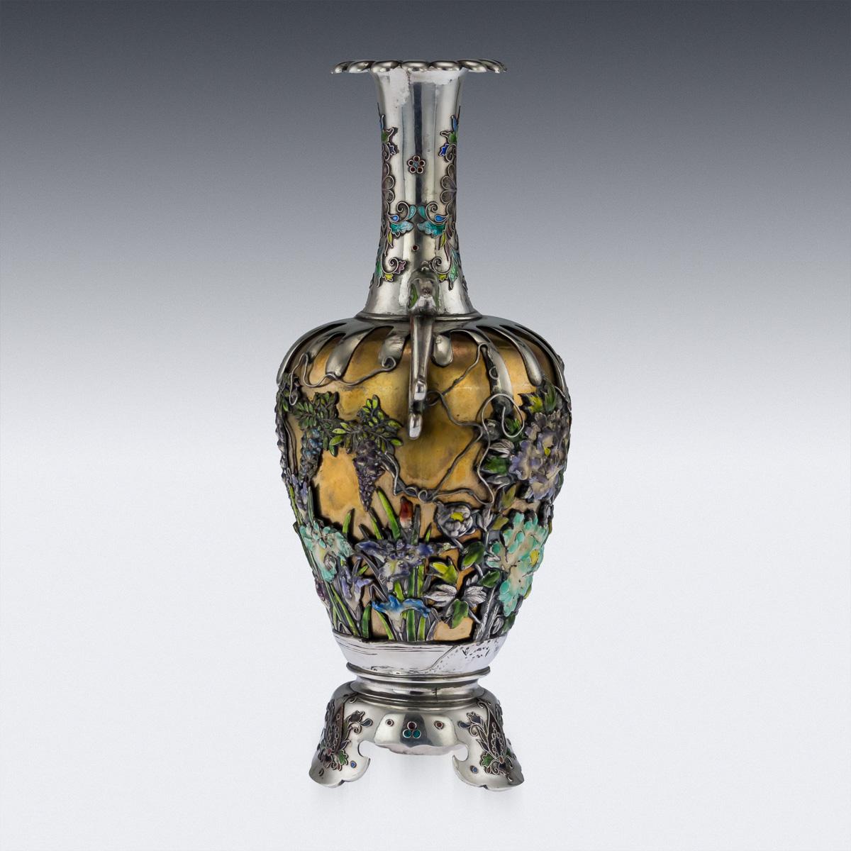 Description:

Antique late 19th century Japanese Meiji period exceptional quality solid silver and enamel vase, The body decorated with butterflies fluttering amongst chrysanthemum, wisteria and foliage, the neck and foot with stylized flower