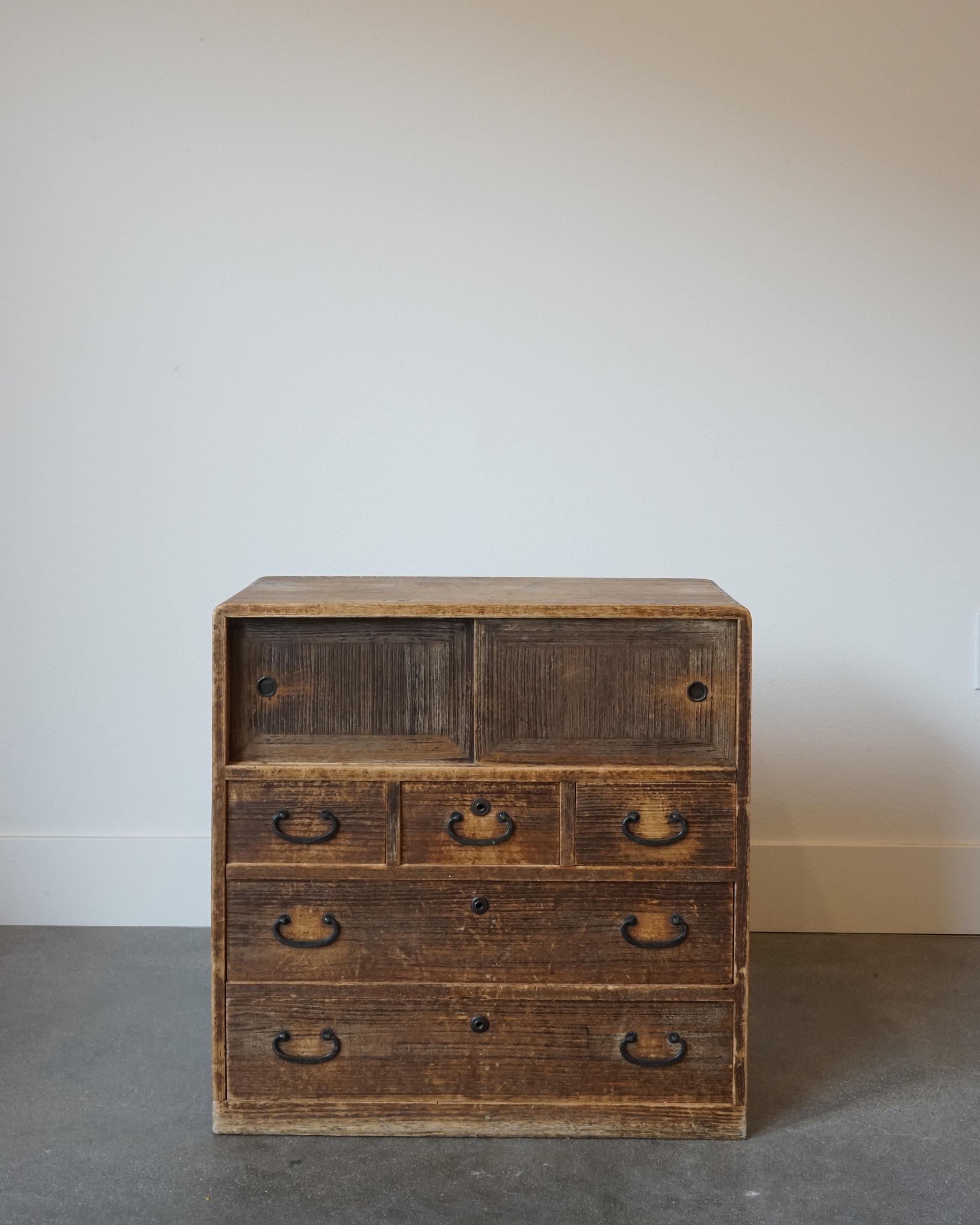 Beautiful patinated wooden small tansu from Japan. Tansu chests are very popular throughout Japan and were originally created as a portable set of drawers. Crafted using Japanese joinery with the exemption of nails or screws, they are ideal for