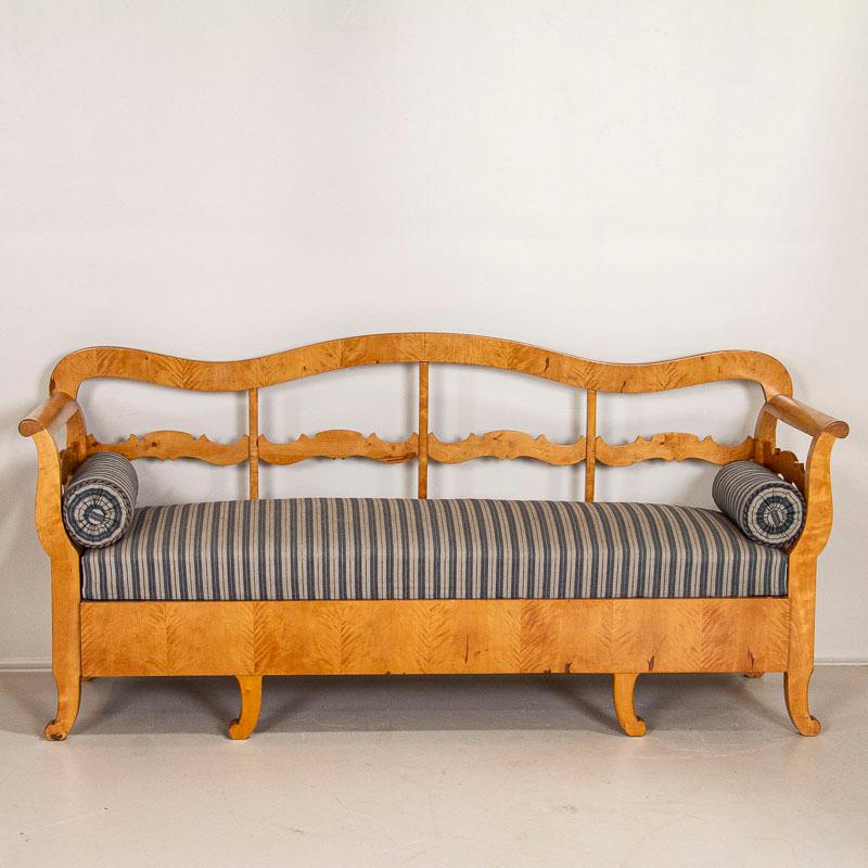 Antique Karl Johan Swedish bench is made from lovely yellow birch and has a lovely curved back. This style of bench originally served as a type of spare bed as the bottom could pull out revealing a type of 