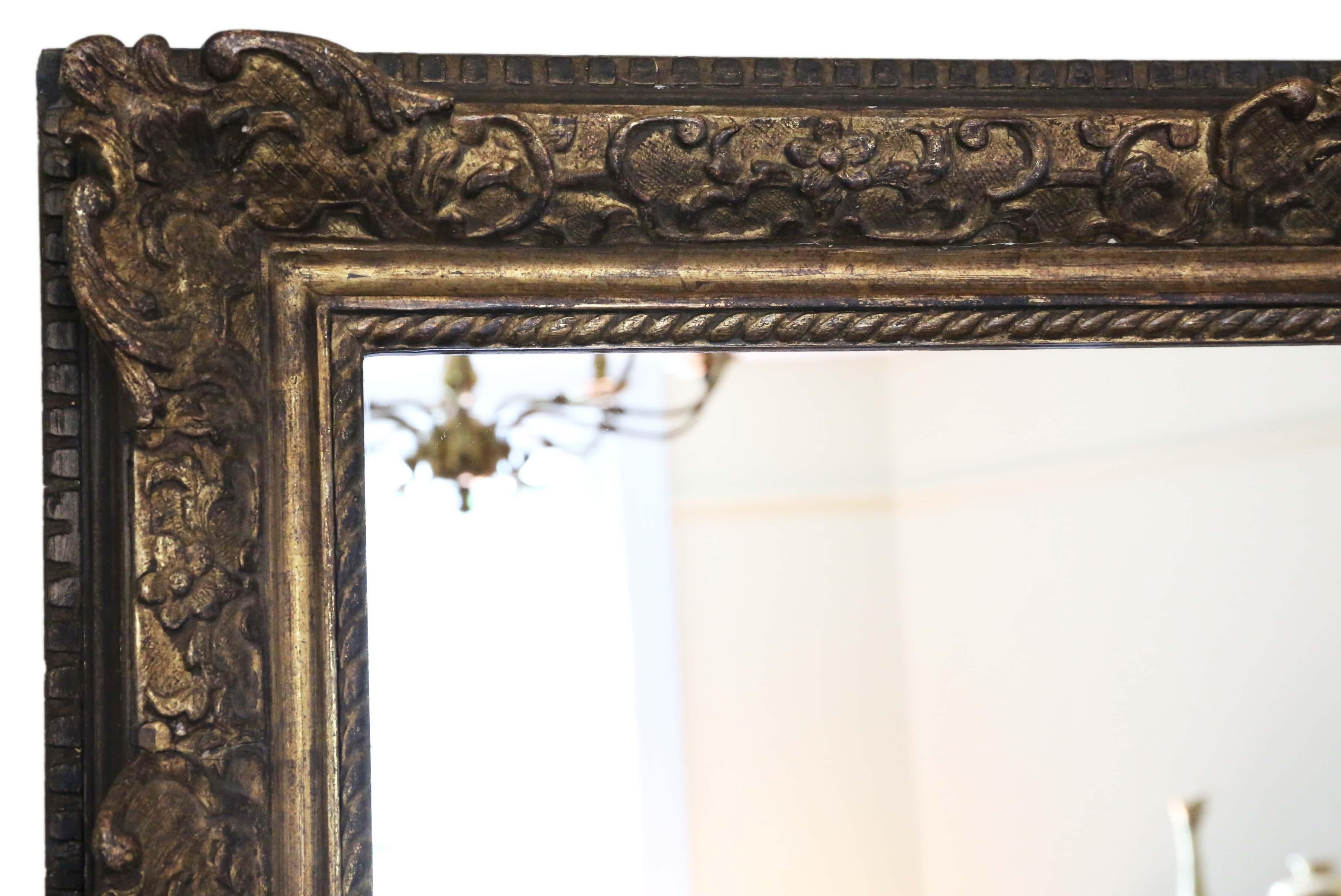 Antique large quality 19th century gilt overmantel or wall mirror. A great look.
A charming mirror, that is full of age and character. Lovely frame with some losses touching up, refinishing and repairs over the years. No loose joints and no