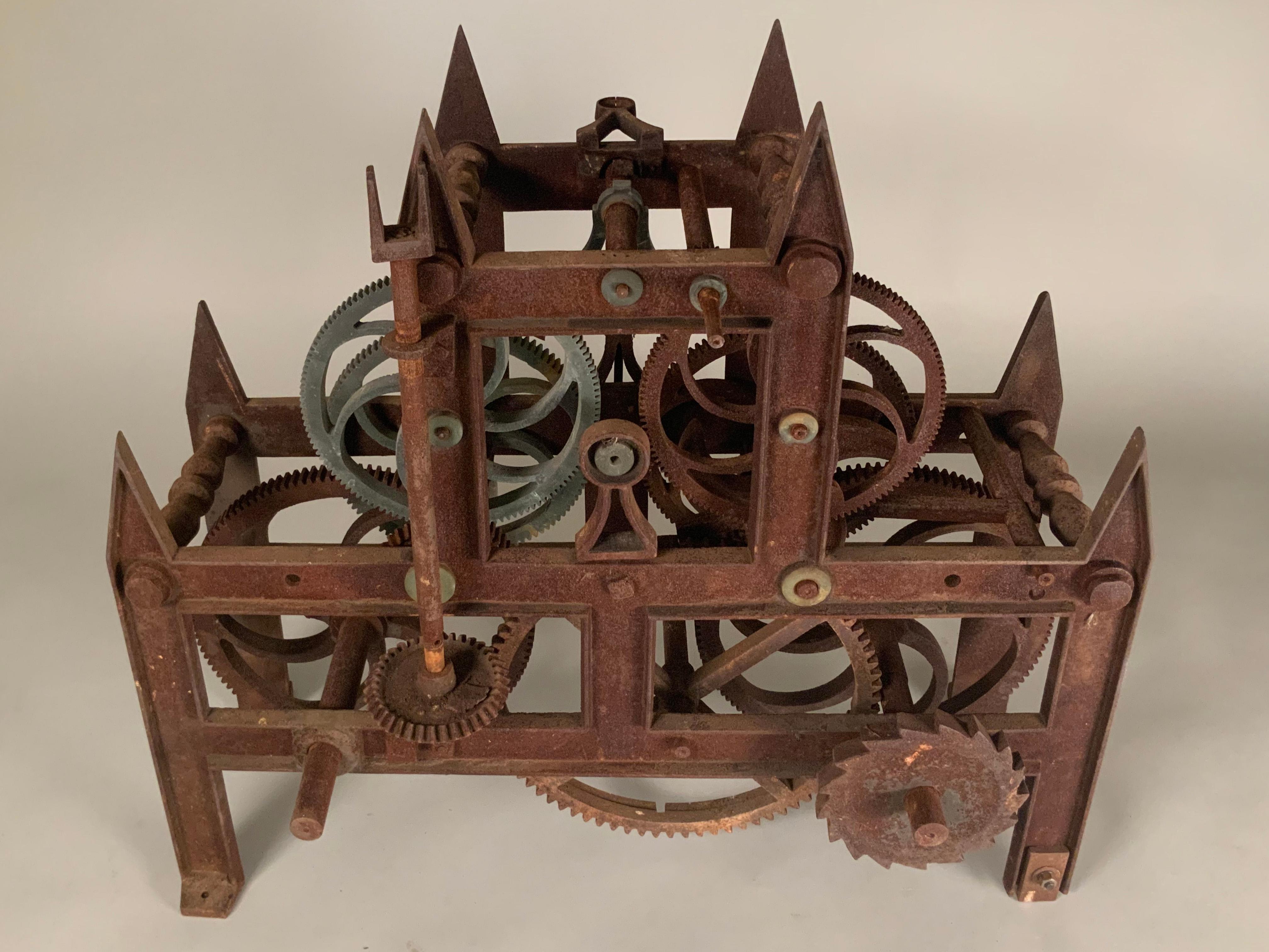 A large and intricate antique 19th century cast iron clockworks from a clock tower. Beautiful gothic design filled with gears which still turn and are interconnected. A wonderful piece of sculptural decorative art.