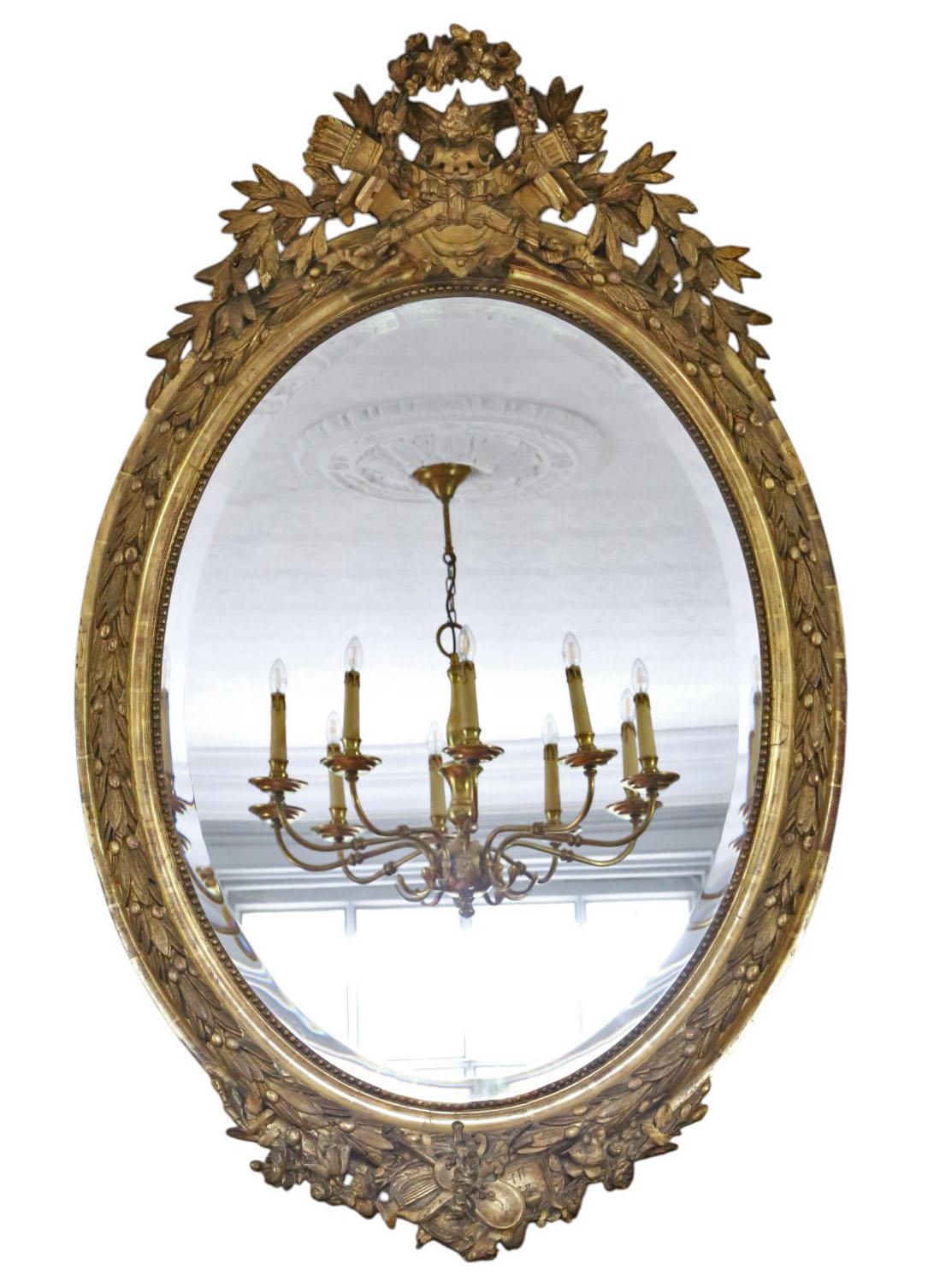 Antique 19th Century Large Oval Gilt Wall / Overmantel Mirror – Ornate Gold Statement Frame

Introduce timeless elegance to your home with this Large 19th Century Antique Oval Gilt Mirror, ideal as an overmantel mirror above a fireplace or as a