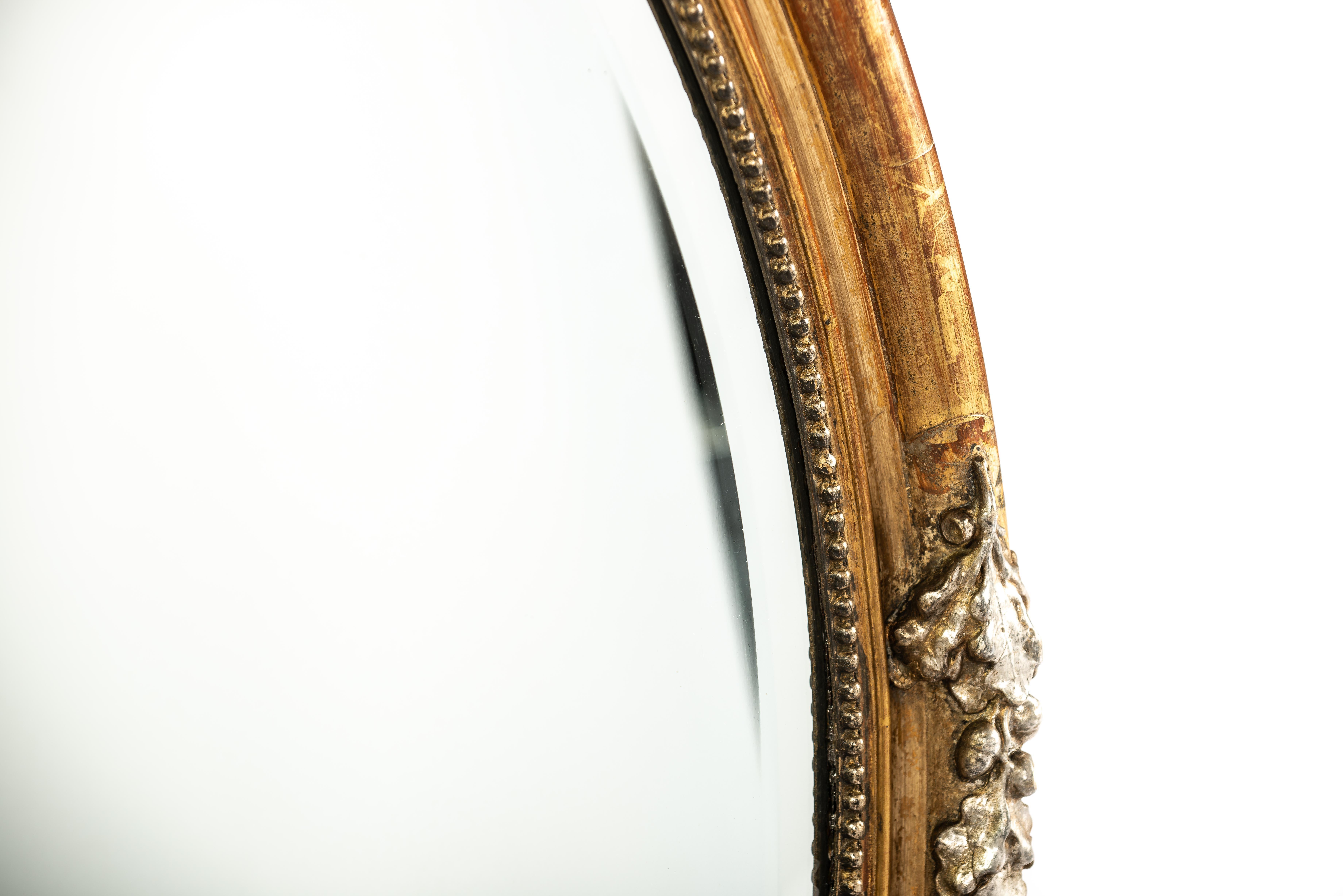 19th Century Antique 19th century large oval gold and silver leaf gilt French mirror For Sale