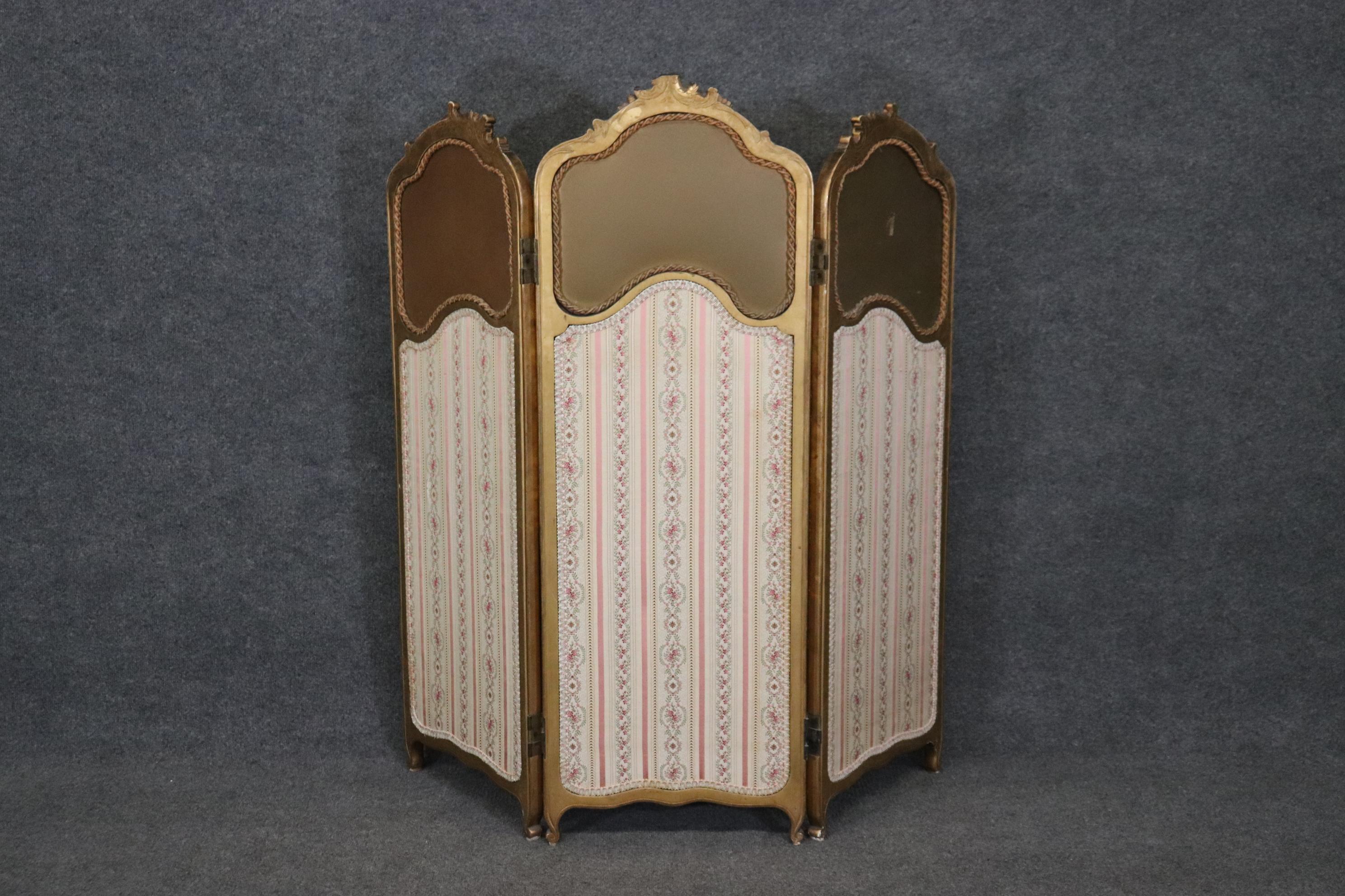 Dimensions:  H: 49 1/2in  W: 49 1/2in D: 1in to 16in

This 19th century Louis XV style 3 panel screen room divider is truly a beautiful piece! If you look at the photos provided, you will see the elaborate carved gilt frame holding upholstered