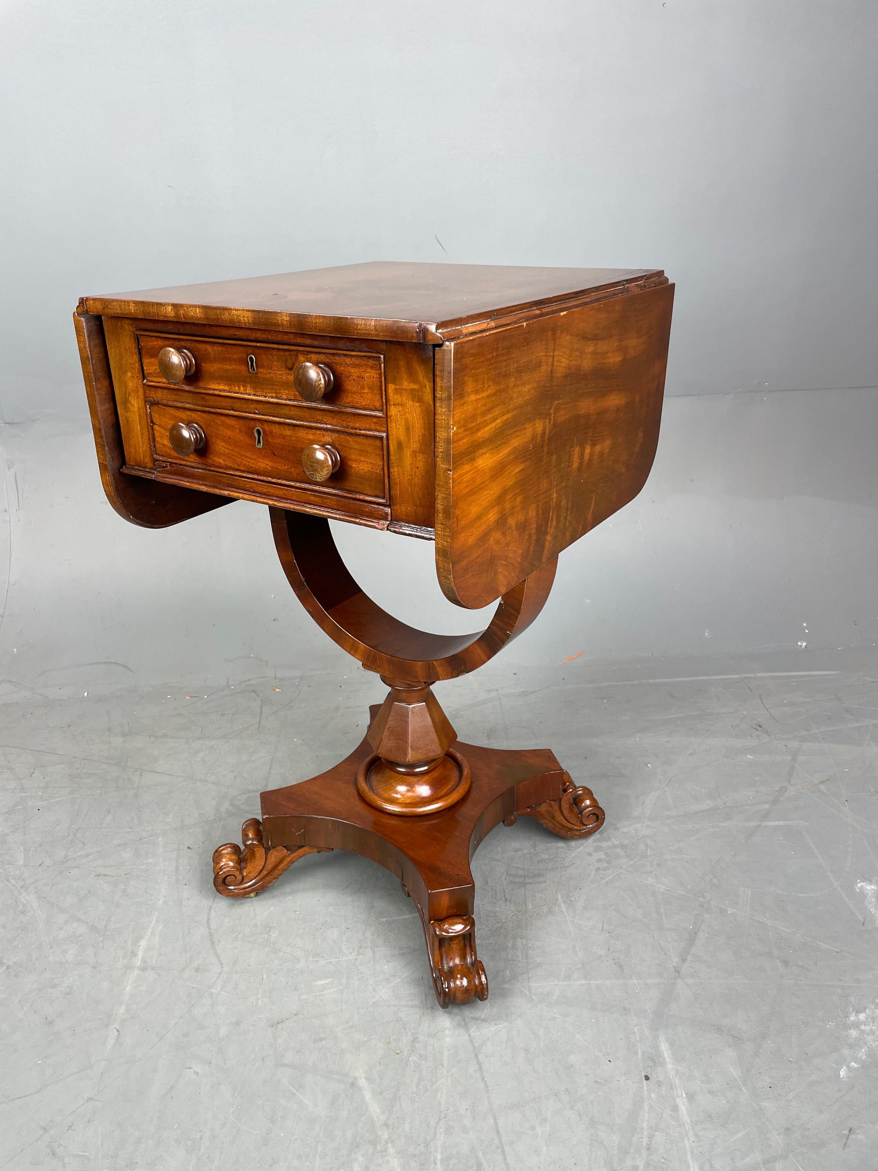 Fine Quality 19th century flame mahogany lamp end table circa 1840.
The table is a wonderful Size with two drop flaps and a single deep drawer. The depicting two drawers. To the opposing side there are two dummy drawers.
The top stands on a very