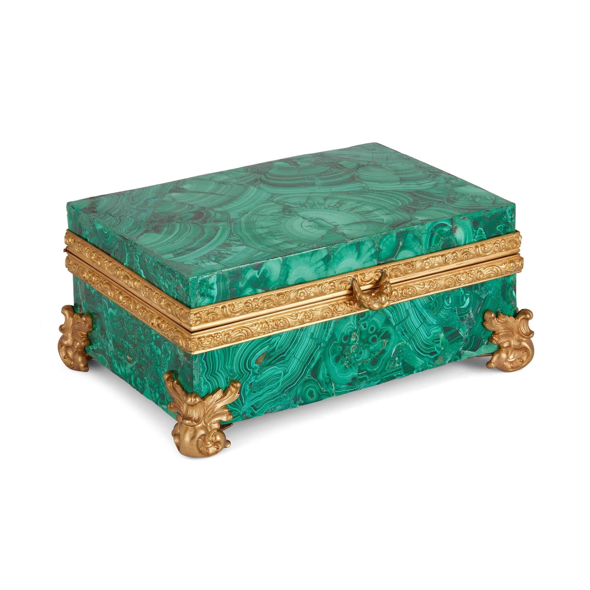 Antique 19th century malachite and ormolu casket 
Russian, Mid-19th Century
Height 9cm, width 21cm, depth 15cm

This magnificent malachite casket celebrates the work of 19th century Russian craftsmen. 

Of a rectangular shape, the casket is covered