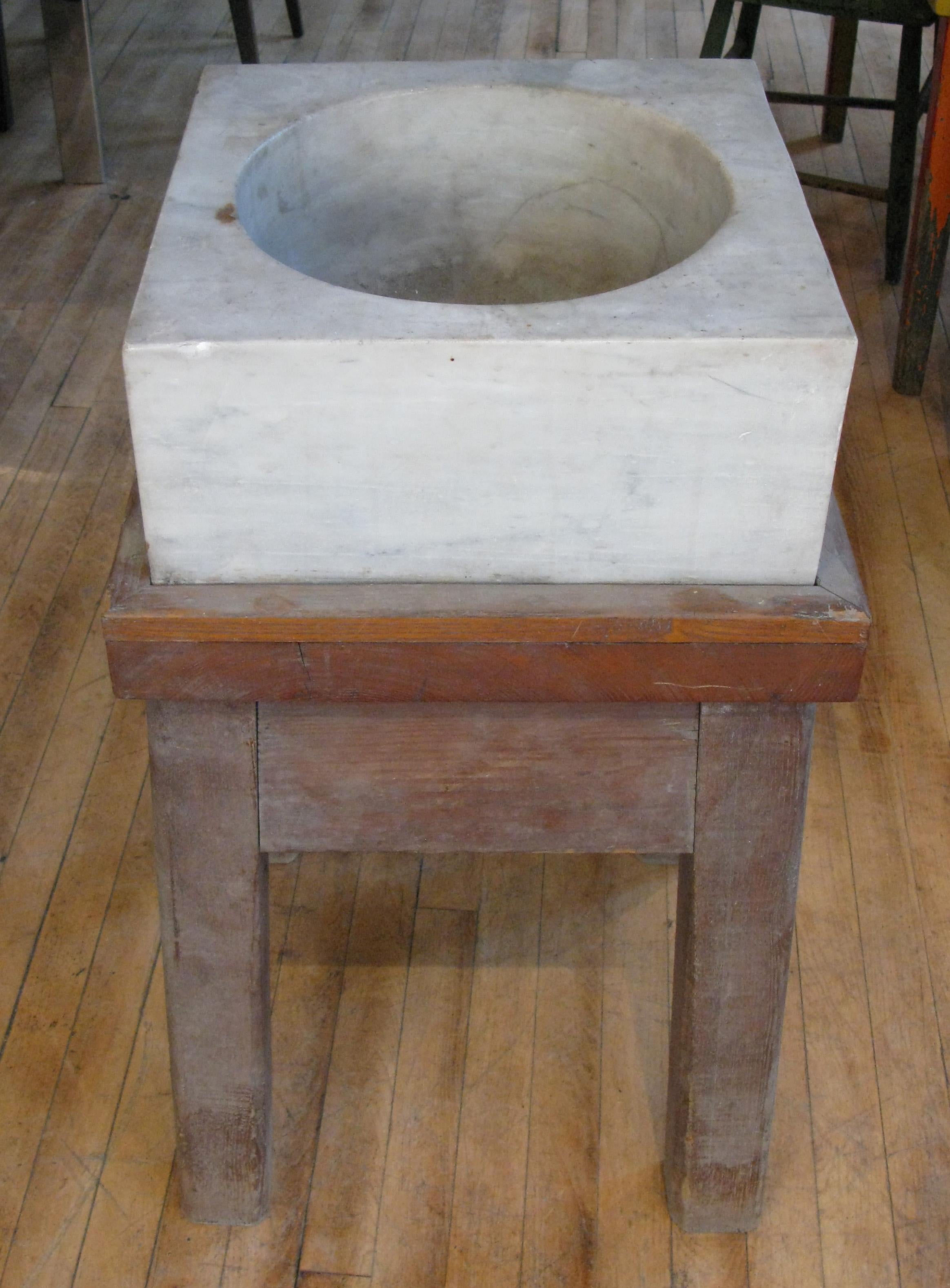 A very handsome and unique antique late 19th century marble mortar on its original oak stand, from the Harold Brown Villa in Newport, RI. this was used for grinding and preparing spices and herbs. the house was decorated by Ogden Codman, who also