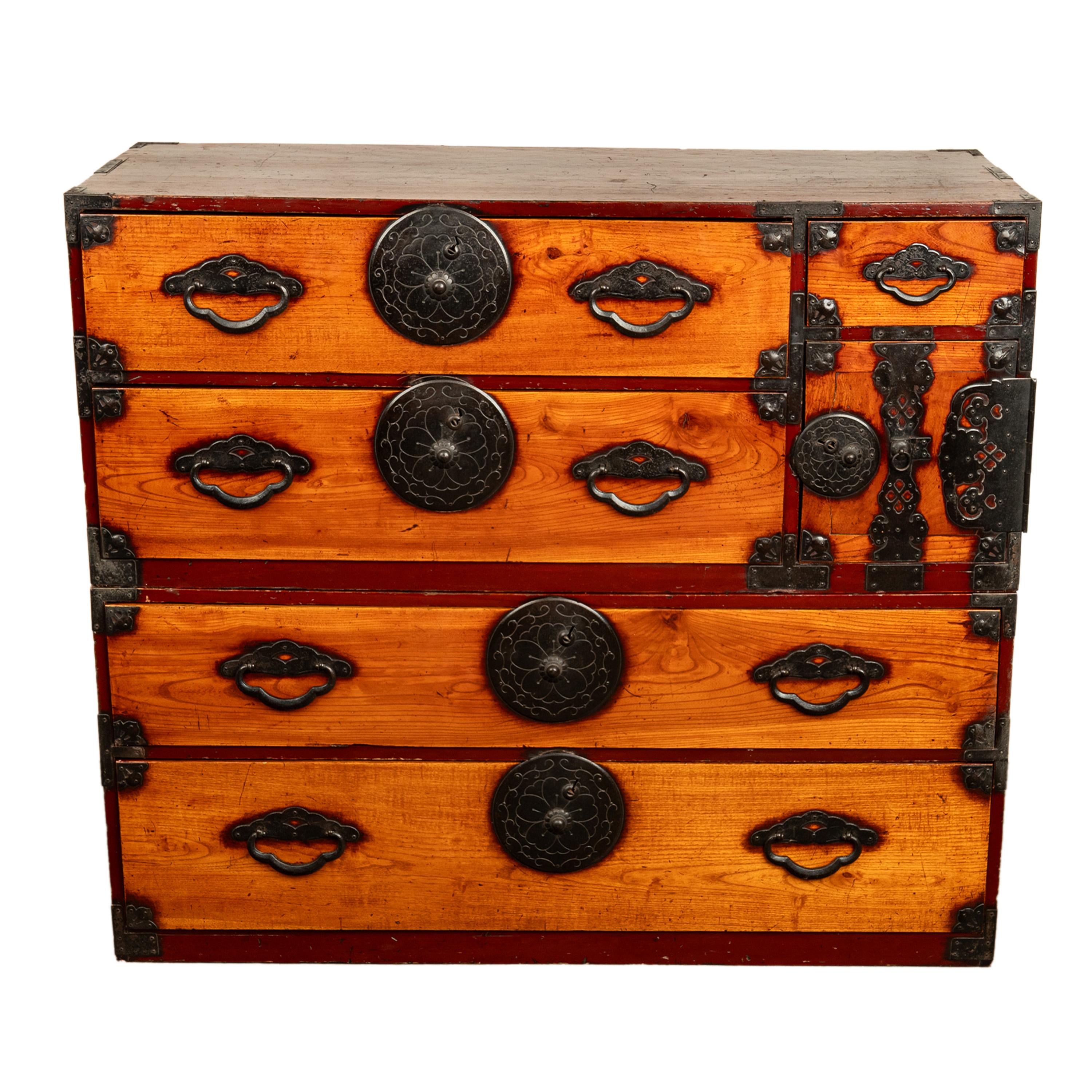 A good antique Japanese Meiji period Isho Dansu, Tansu chest, circa 1880.
This very stylish antique Japanese chest is in two sections, with hinged carrying handles at the side of each section. The chest is made from Kuri (chestnut) and Hinoki