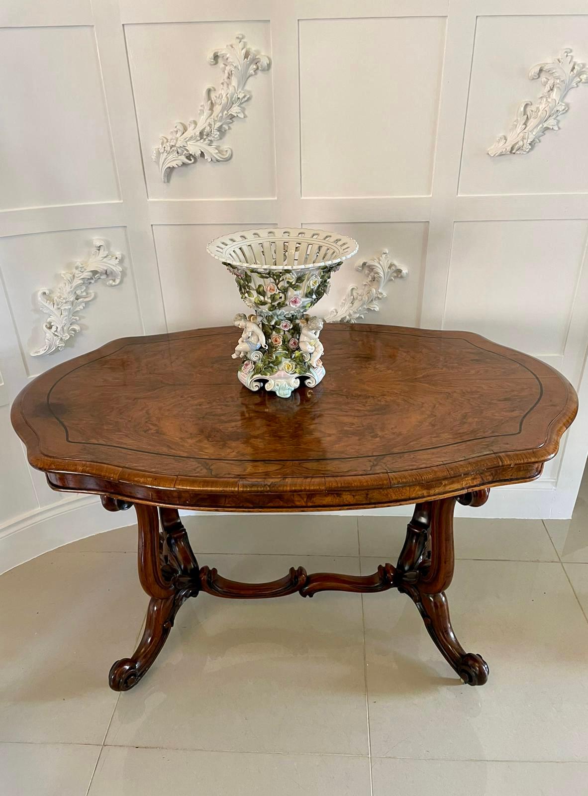 Antique 19th century Meissen Style centrepiece having an openwork bowl applied with pretty trailing roses and supported on an attractive base applied with three charming winged putto and conforming trailing roses, raised on three elegant scrolled