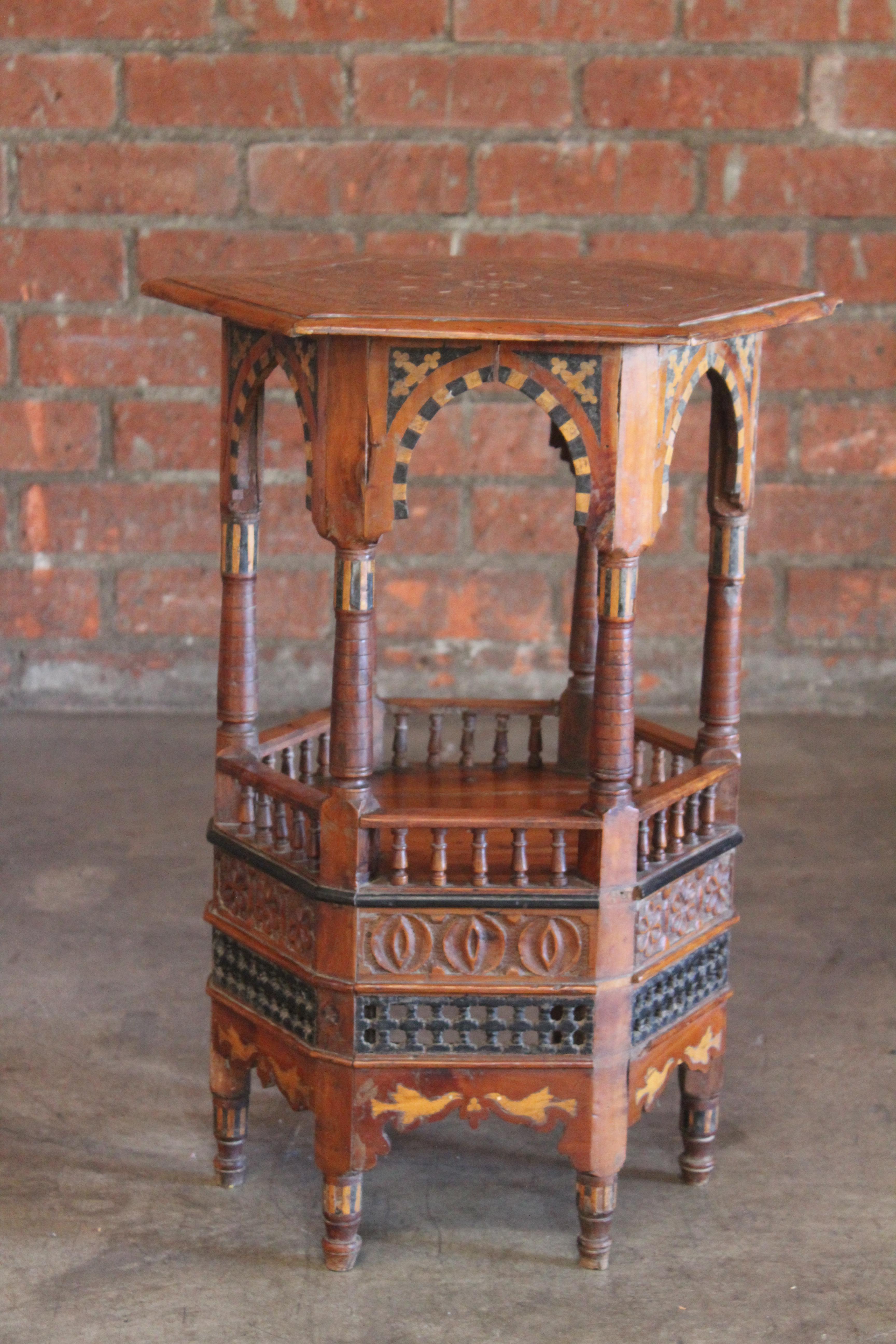 A beautiful antique Moorish or Syrian side table with intricate carved details and mother of pearl and bone inlay with ebony. Absolutely stunning piece with age and character. In overall wonderful condition considering age.