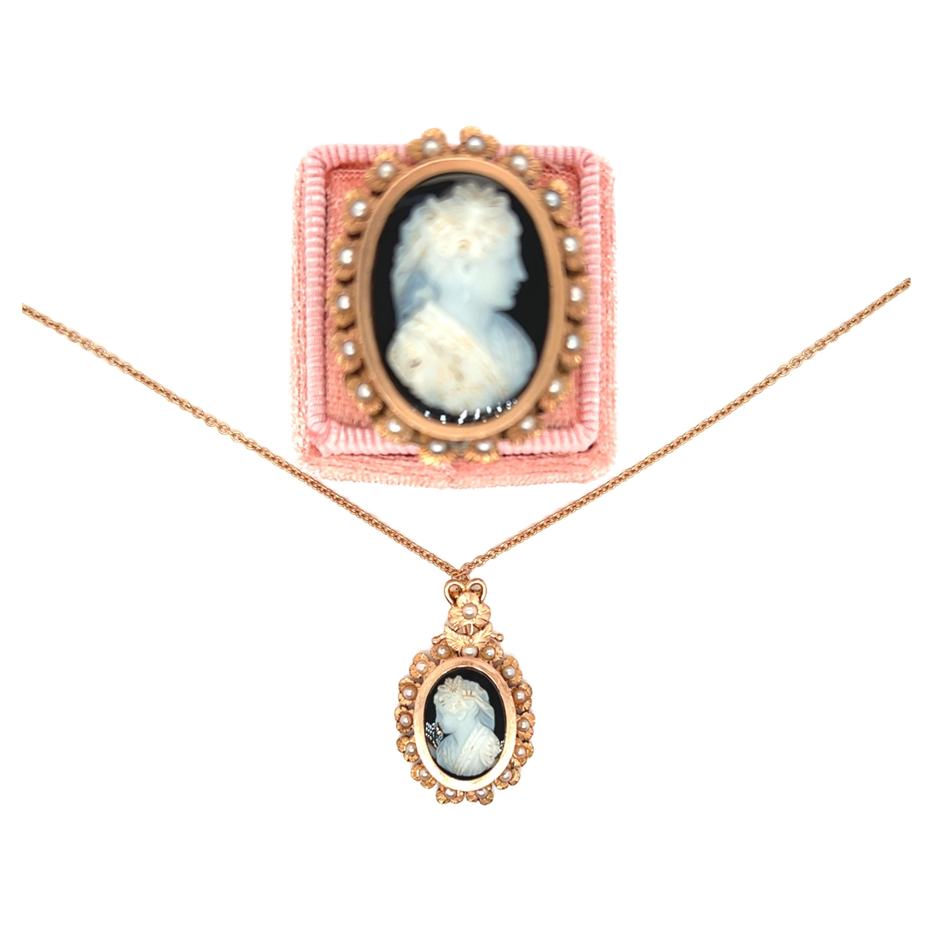 An antique ring and pendant set with a two-layered cameo on onyx,  oval in shape representing the profile of a woman. The ring features a graceful feminine silhouette framed by a captivating halo of three petaled flowers with seed pearl centers.