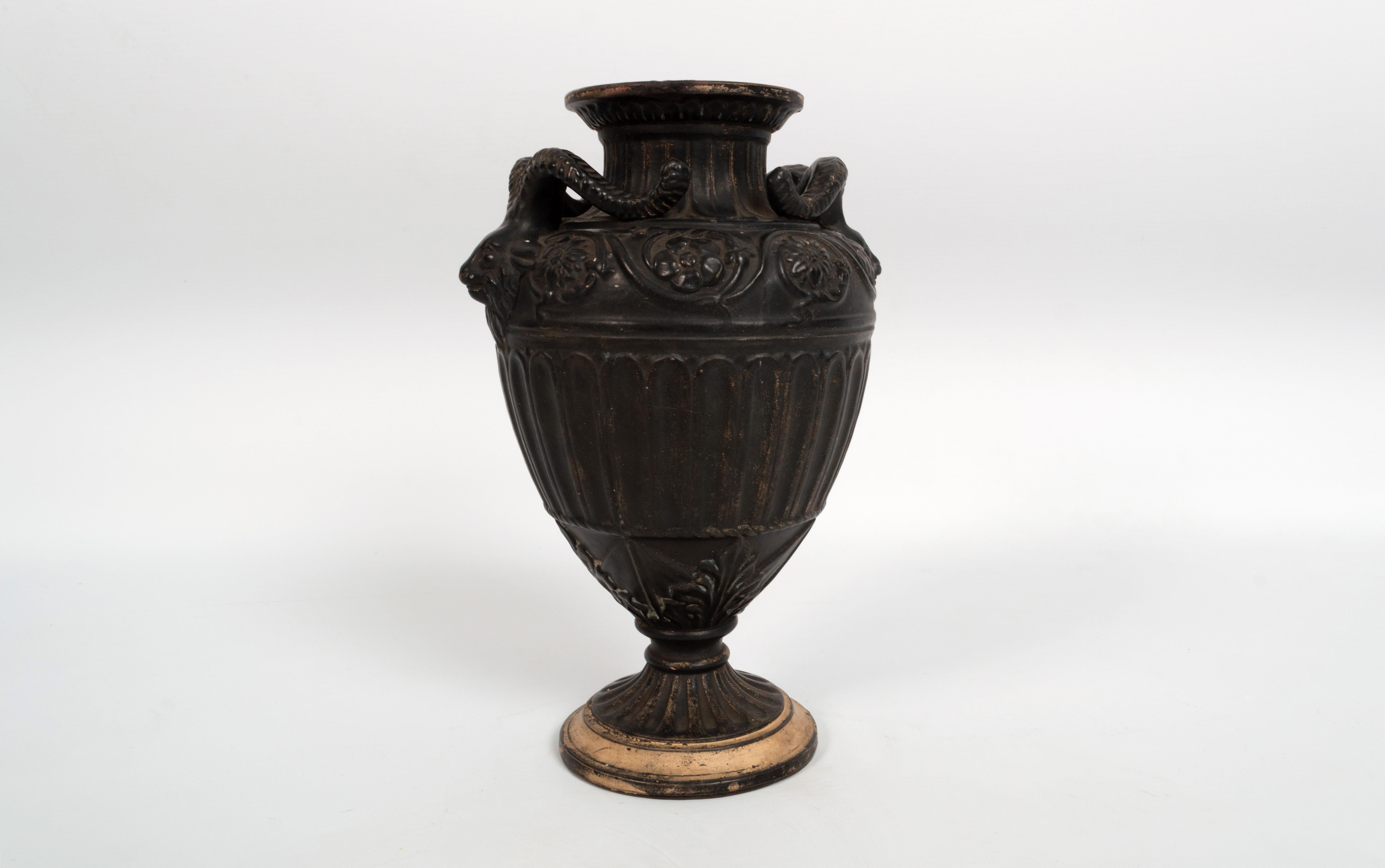 Antique 19th century neoclassical Vase By Gerbing & Stephan Germany 1892.

Ebonised earthenware, of baluster form with horned mask handles, on a circular footed base, with impressed marks to the underside 'G.&St. 1892 0'.


In very good