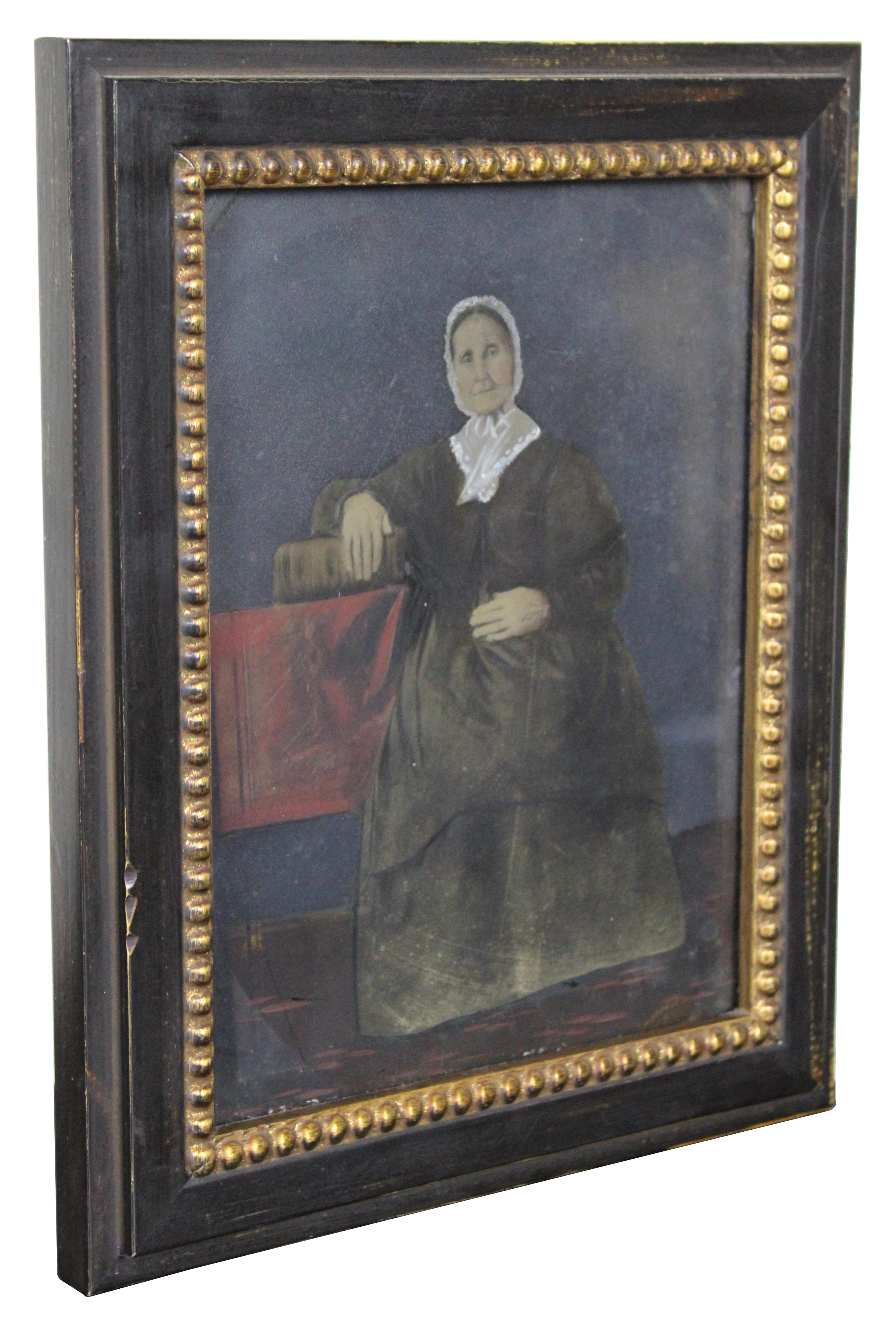Fine antique oil painting on tin. A portrait painting of an elderly woman in black with a lace fichu bonnet seated at a table with her hand on a book.

Measures: 8.5” x 0.75” x 10.5” / Sans Frame - 6” x 8” (Width x Depth x Height).