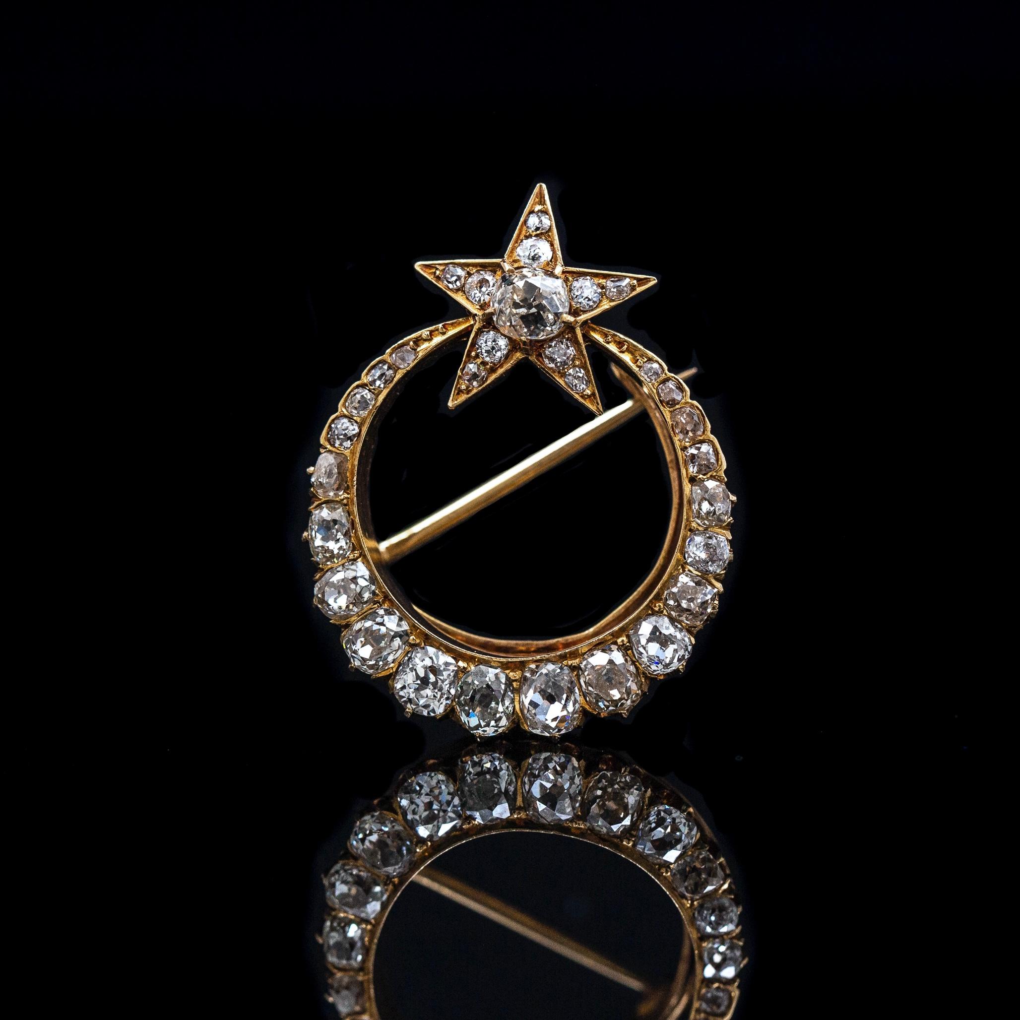 Antique 19th century Old Mine-cut Diamond crescent moon with star brooch / pendant in yellow gold, circa 1860. Designed as an elegant single-row crescent moon with a 5-point star at the opening, grain-set throughout with 31 Old Mine-cut diamonds