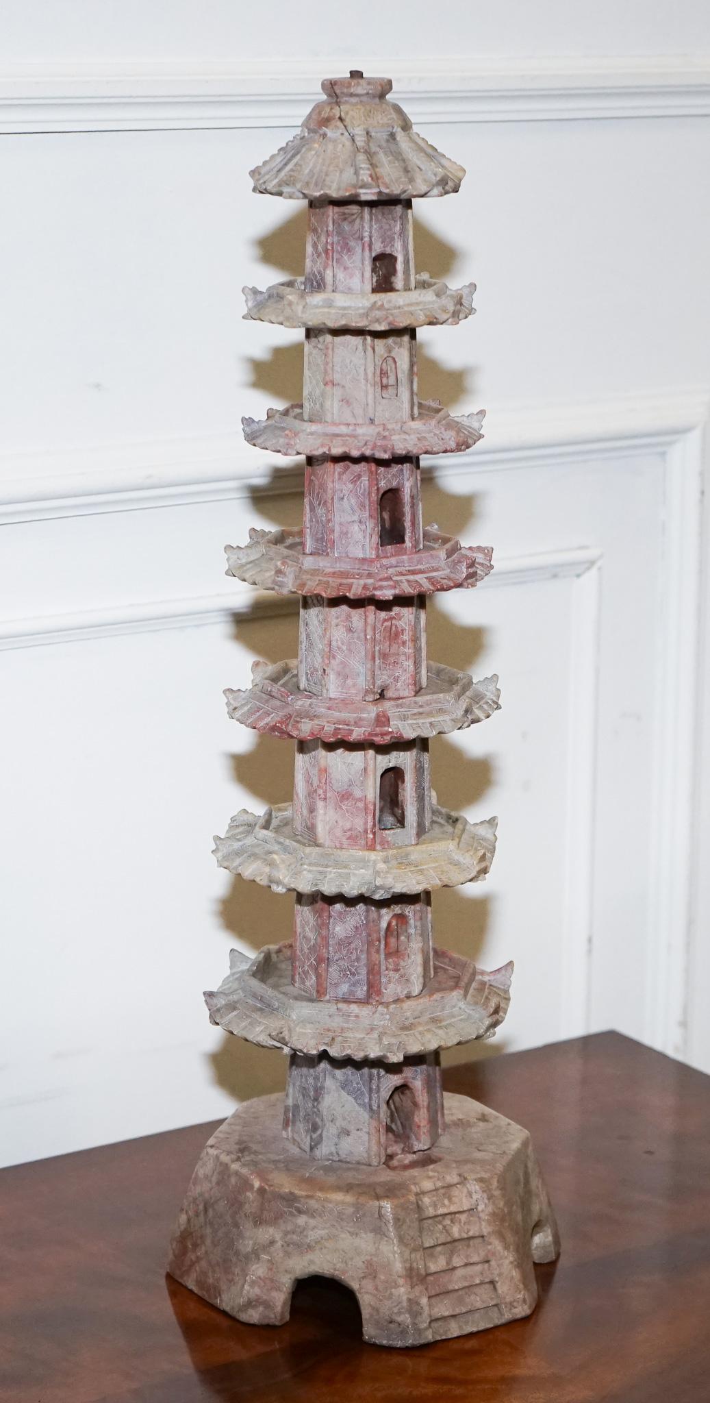 
We are delighted to offer for sale this Oriental Antique Carved Soapstone pagoda. 

Originating from the Orient in the 19th century, this is a highly decorative piece meticulously carved from soapstone. The multiple tiers, each with sloping roofs,