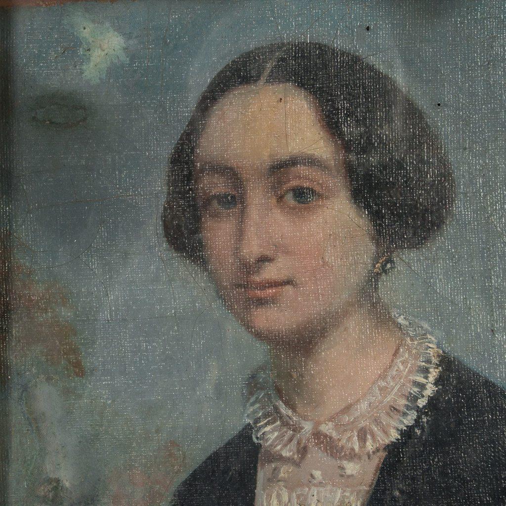 This well rendered and detailed antique Danish oil painting portrait portrays a lady in period outfit, dressed in black with a white lace collar, circa 1860-1880. There are quite a few repairs to the painting, visible on the front and canvas back