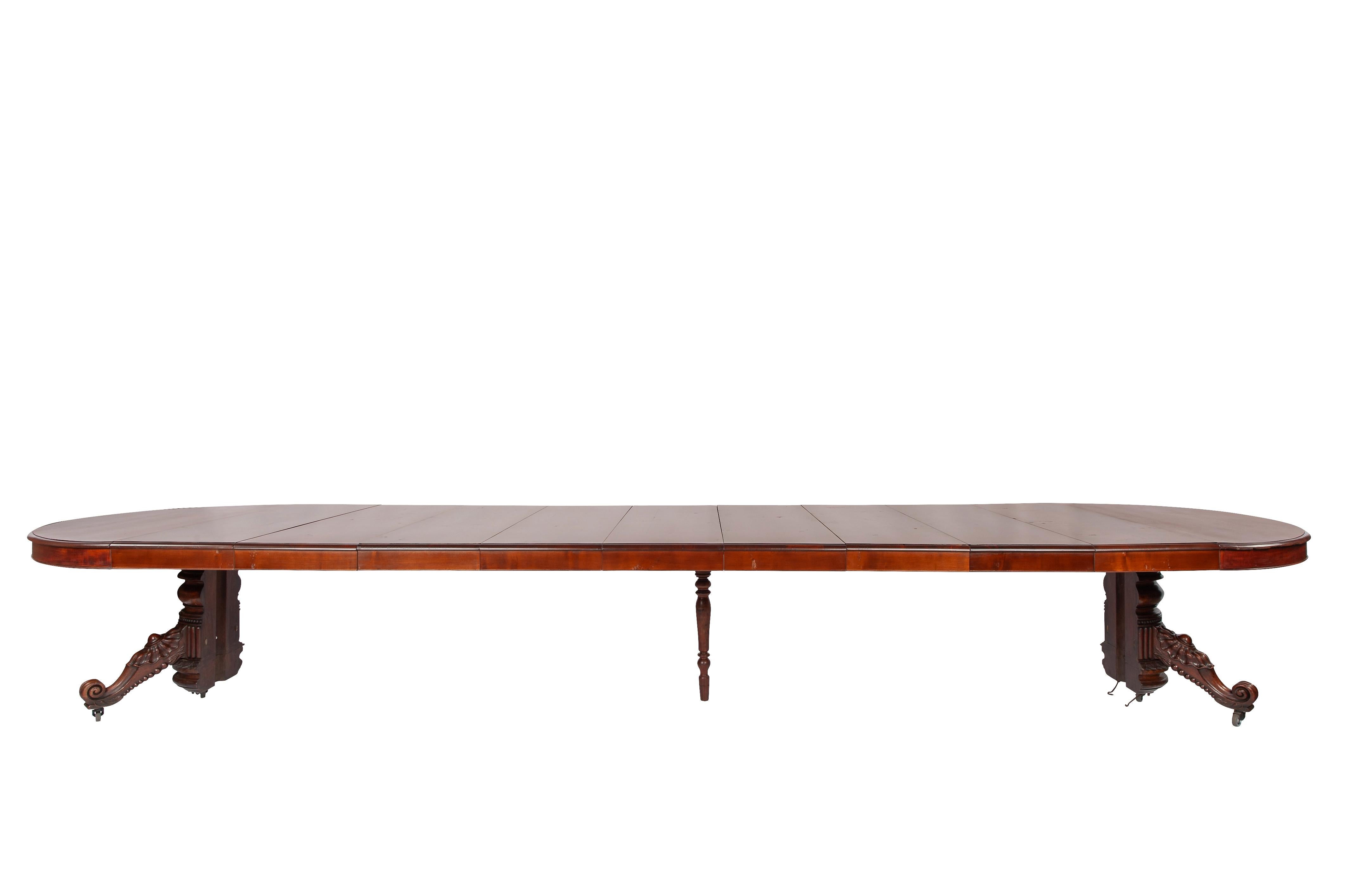 Antique 19th-century oval extendible French warm brown mahogany dining table. For Sale 12