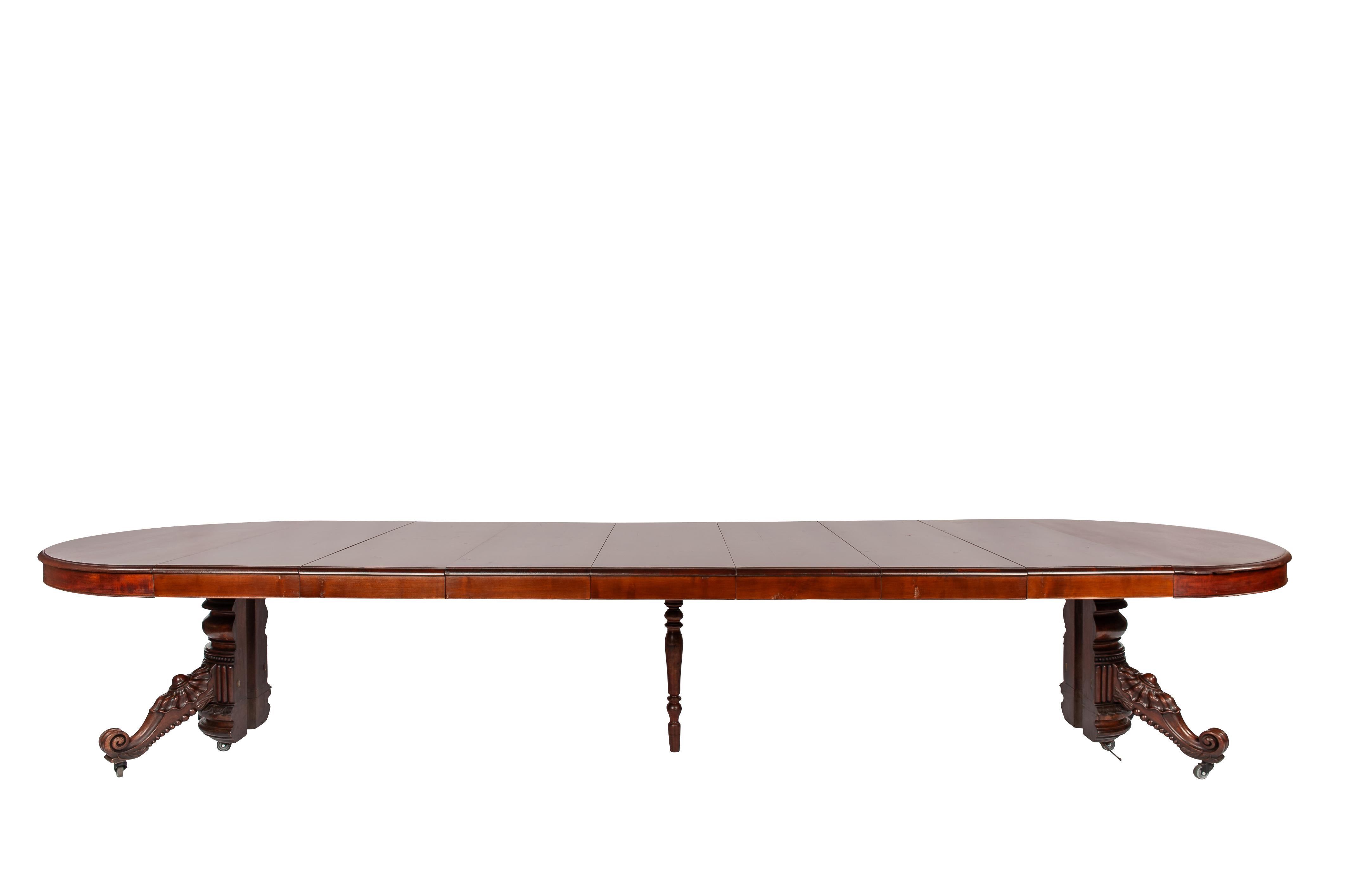 Louis Philippe Antique 19th-century oval extendible French warm brown mahogany dining table. For Sale