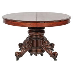 Antique 19th-century oval extendible French warm brown mahogany dining table.