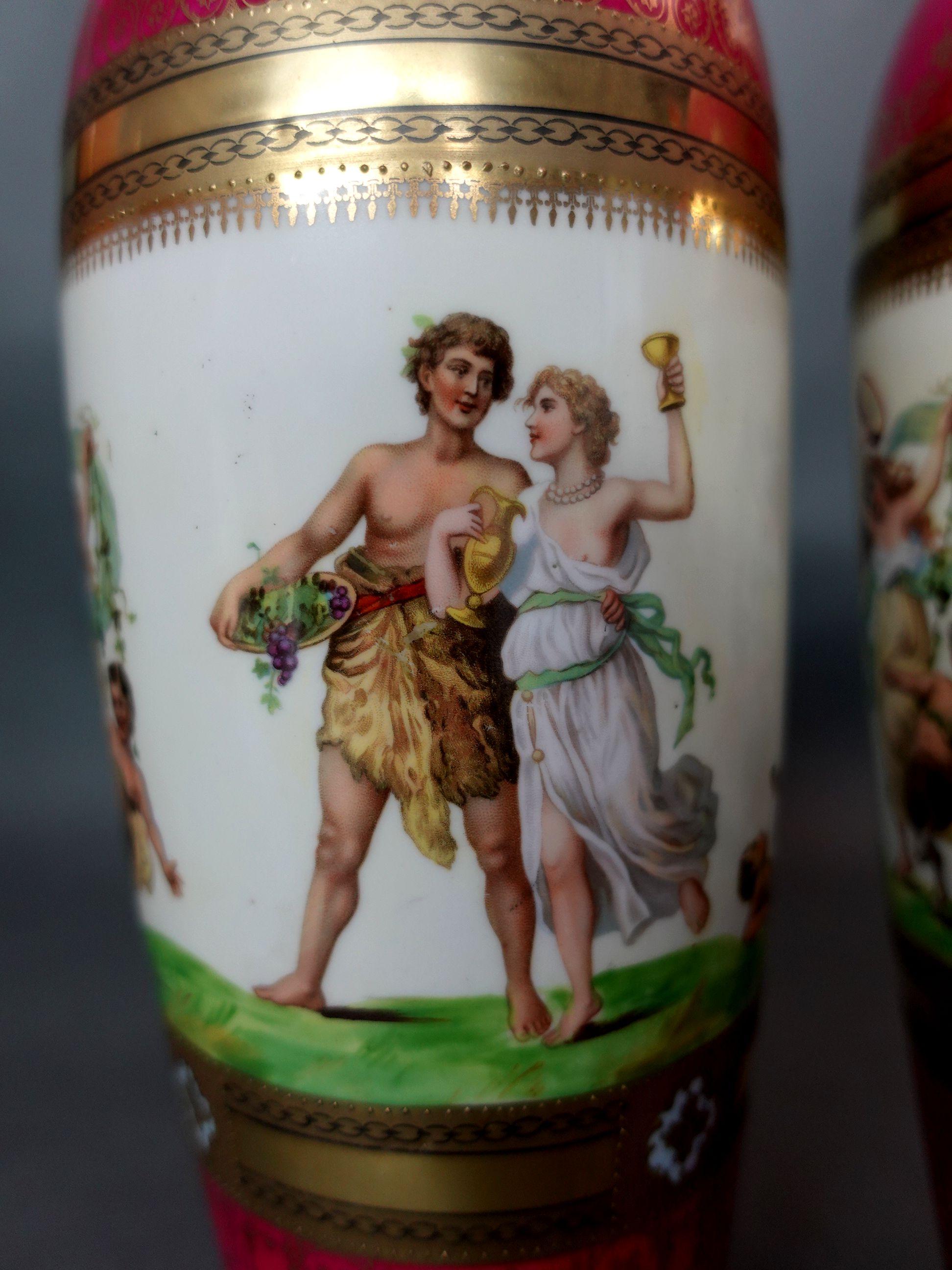 19th century a pair of finely decorated magenta and gilt vases banded with Bacchanal festive procession, from Germany, 