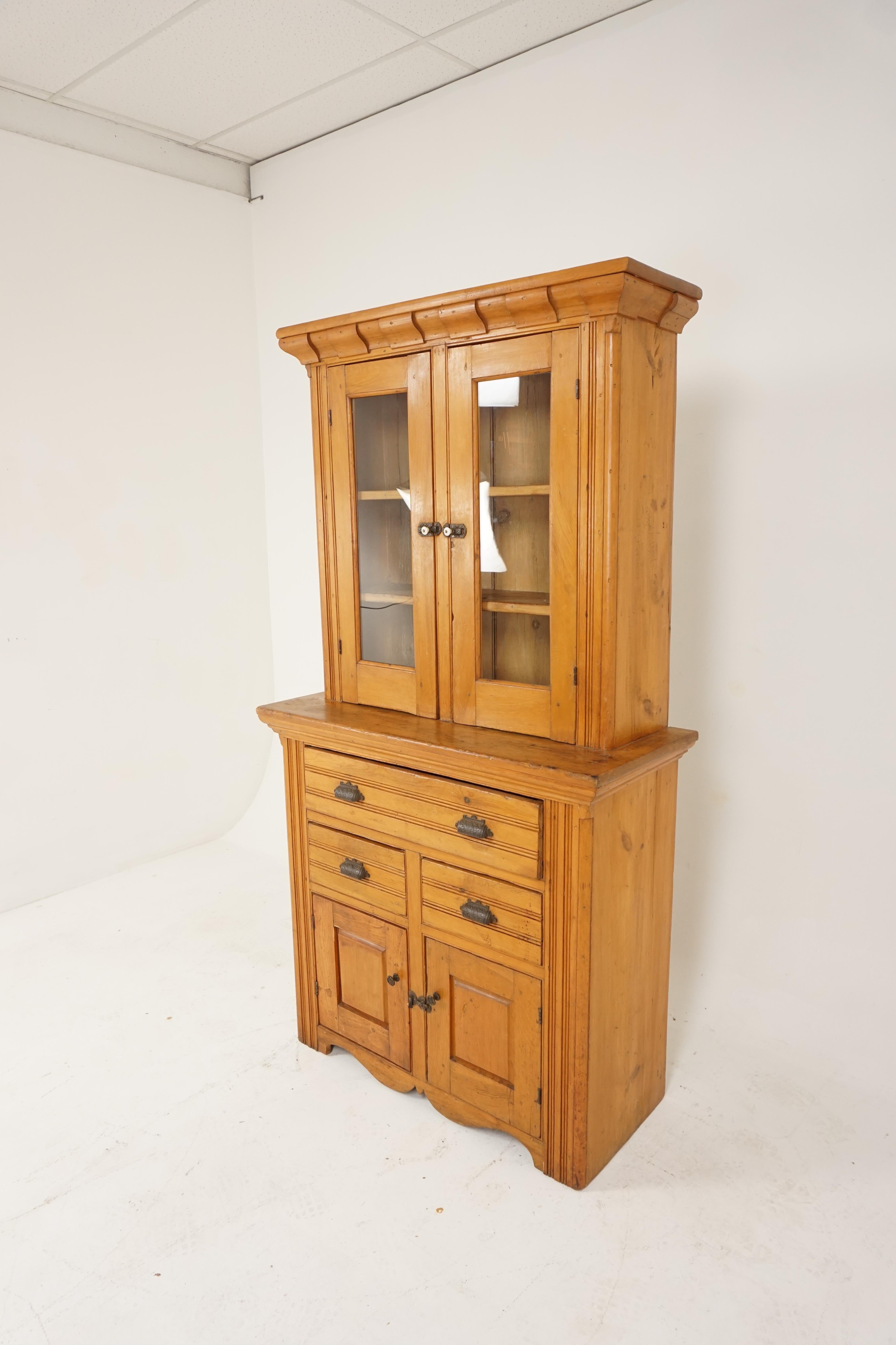 Antique 19th century pine buffet hutch, Pantry Farmhouse, Canada 1870, H326

Canada 1870
Solid pine
Original finish
Large shaped cornice on top
Pair of glass doors open to reveal tow fixed shelves
Original hardware on doors
Lower section has a full