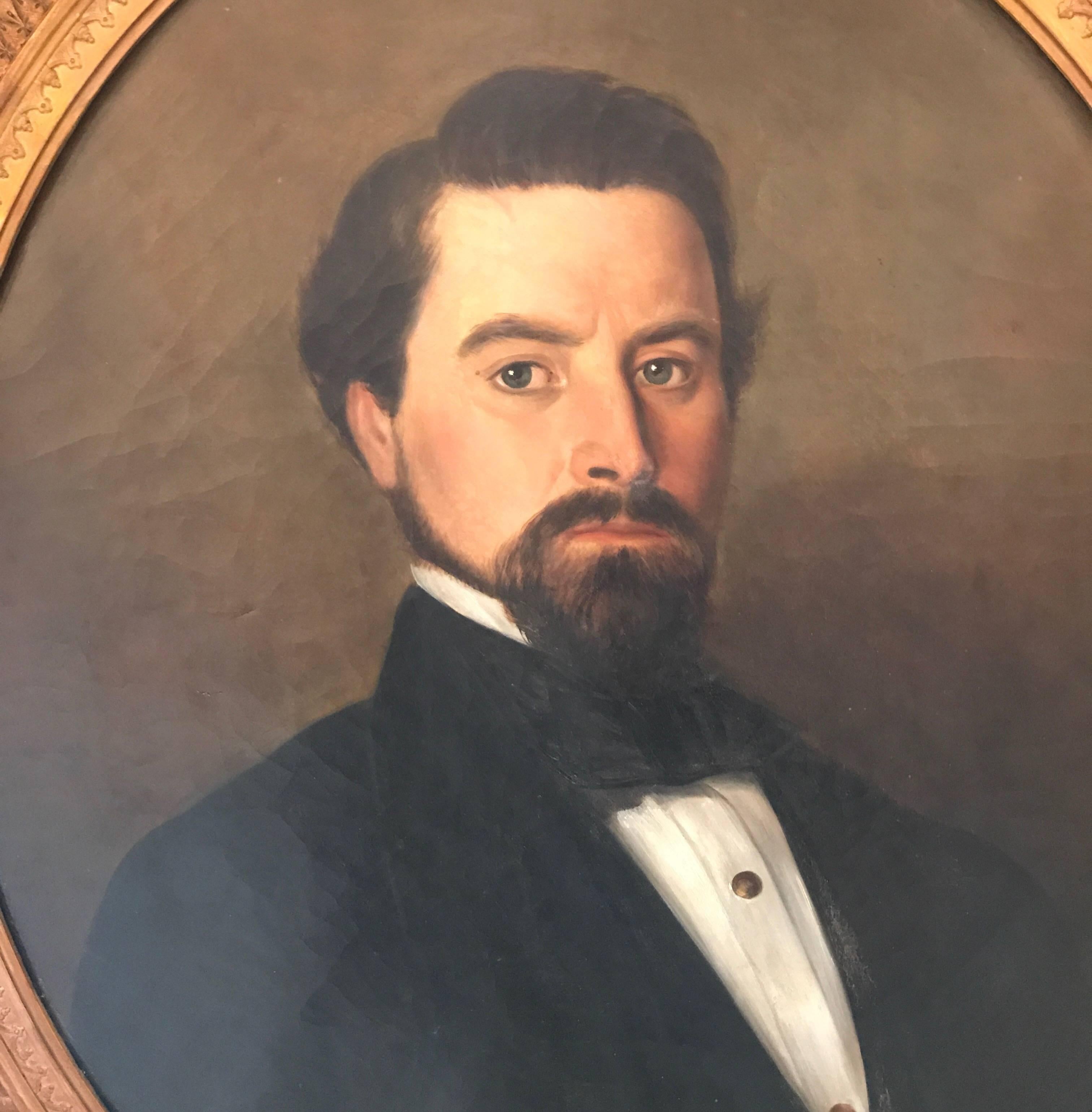 A portrait of a handsome young gentleman, circa 1840 in the original oval frame. Marked on the back of the canvas, New York. The well painted portrait with a well dressed upper class man it expensive ornate frame.