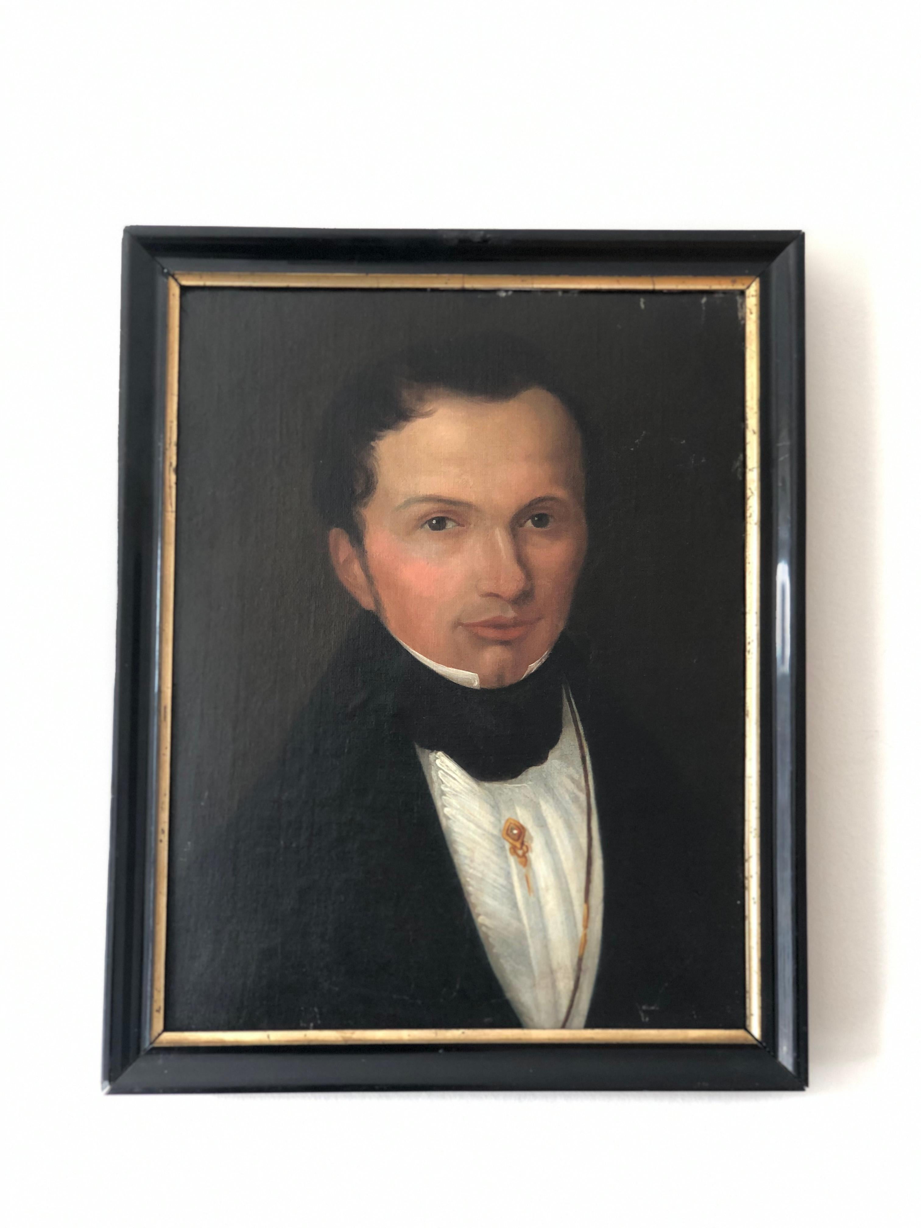 This refined 1840s antique portrait painting presents a Dutch gentleman of notable status, dressed in a crisp white shirt with high standing collars and a black silk necktie. A gold brooch rests on his chest, subtly signifying wealth and refinement.