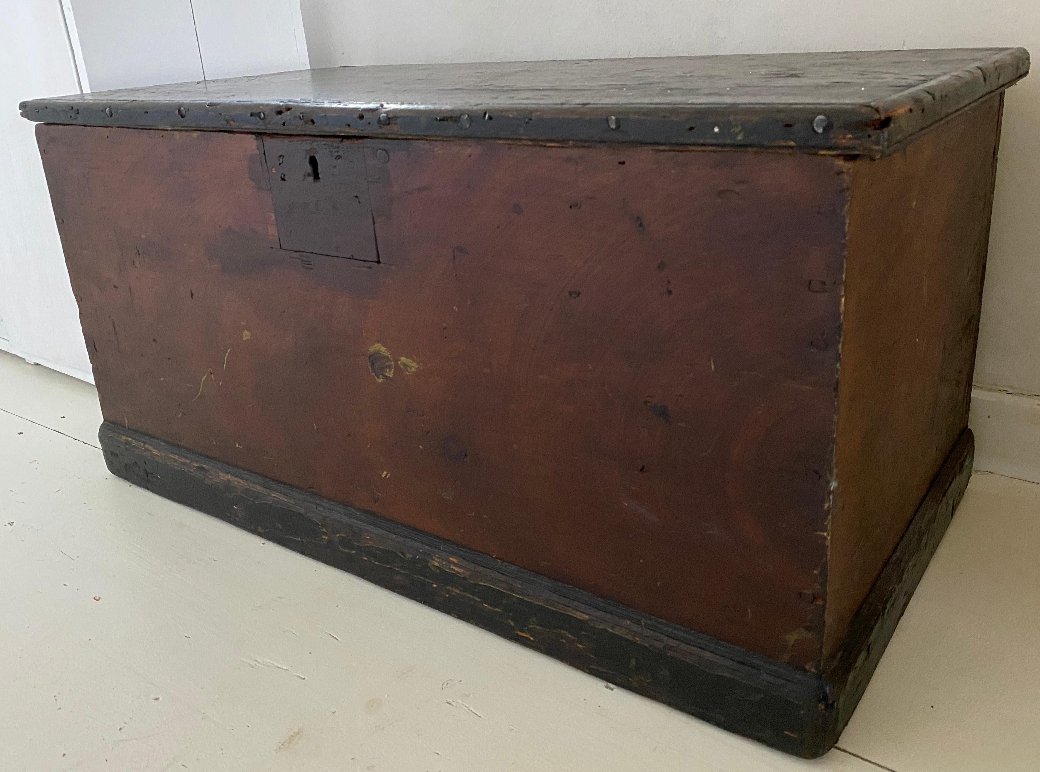 19th century rustic American chest or floor trunk. Can be used for storage or coffee table. Place the blanket chest at the bottom of a bed or in a mud room and add a cushion for a bit of height for seating.