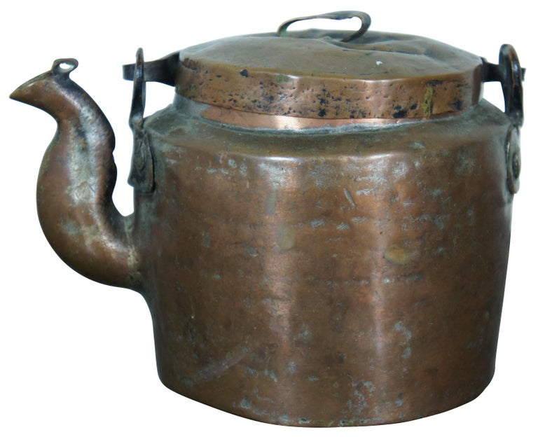 Antique 19th century primitive copper tea kettle with a simple etched design on the handle. Measure: 7
