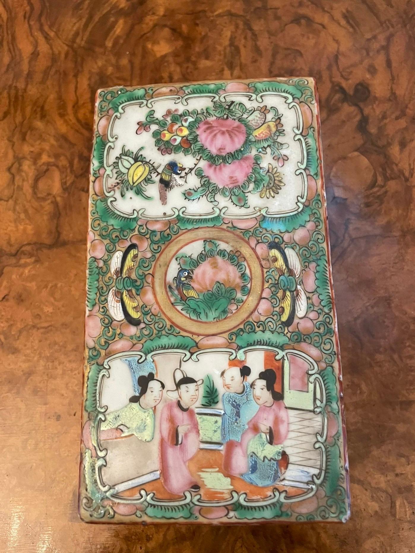 Antique 19th century quality Chinese Famille Rose Canton lidded pen box hand painted in the Famille Rosé taste depicting pheasants and butterflies in foliage and figures in a Chinese courtyard scene. The panels are framed with dense borders of