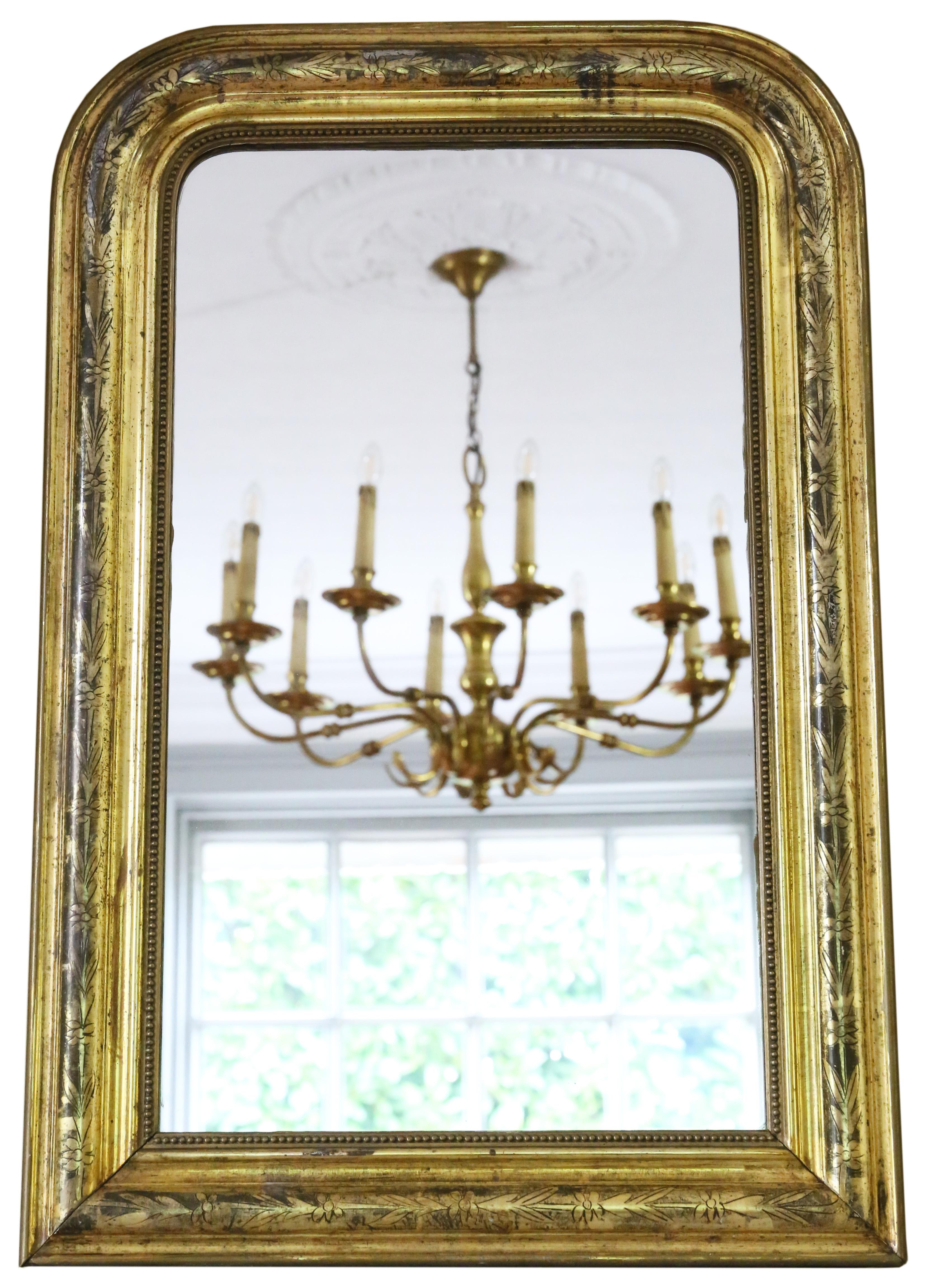 Antique 19th Century gilt Louis Philippe overmantle or wall mirror, showcasing delightful charm and elegance. The original finish, with minor losses, refinishing, and careful touching up, adds to its character.

This impressive find would grace any