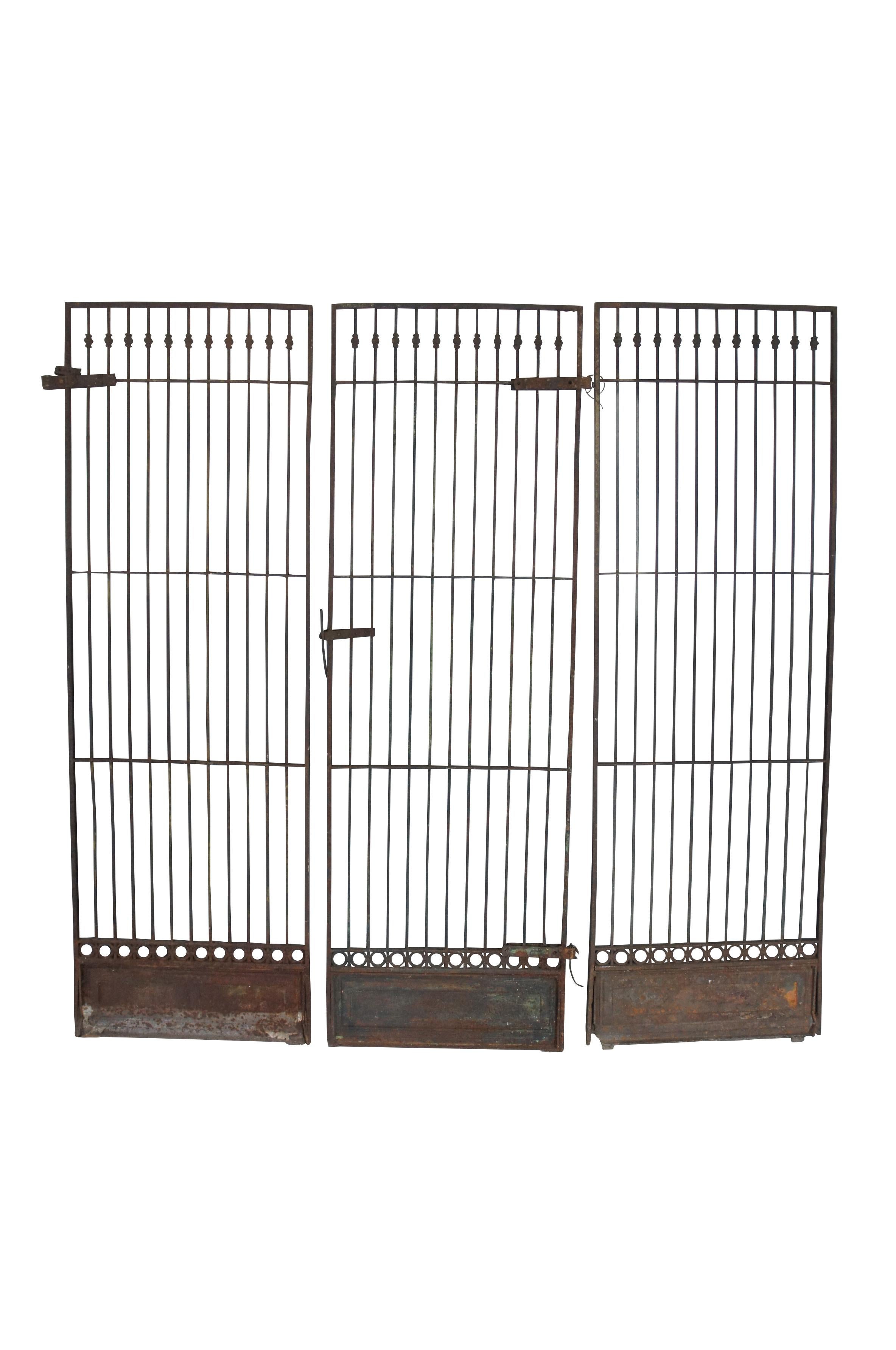 Intriguing set of antique Victorian Era reclaimed architectural wrought iron garden fence grates / gates. 37 available, sold individually. Made from Iron with ornate Neoclassical styling. Each door or panel features squared off vertical posts offset