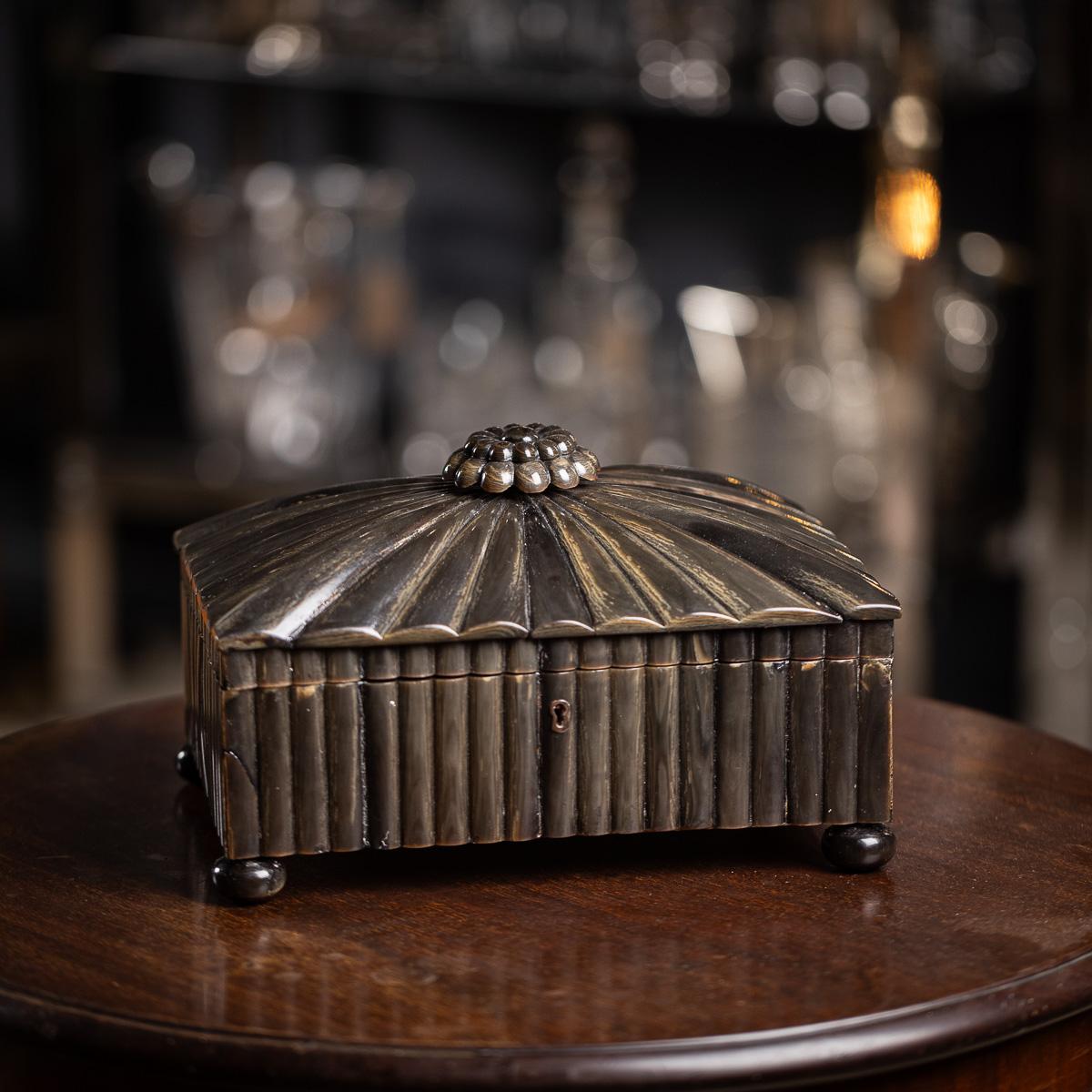 Antique 19th Century finely crafted horn box lined with cedar, featuring a hinged lid topped with a carved lotus flower finial. It stands on turned horn feet and retains its original key. A superb addition to any interior. 

CONDITION
In Great
