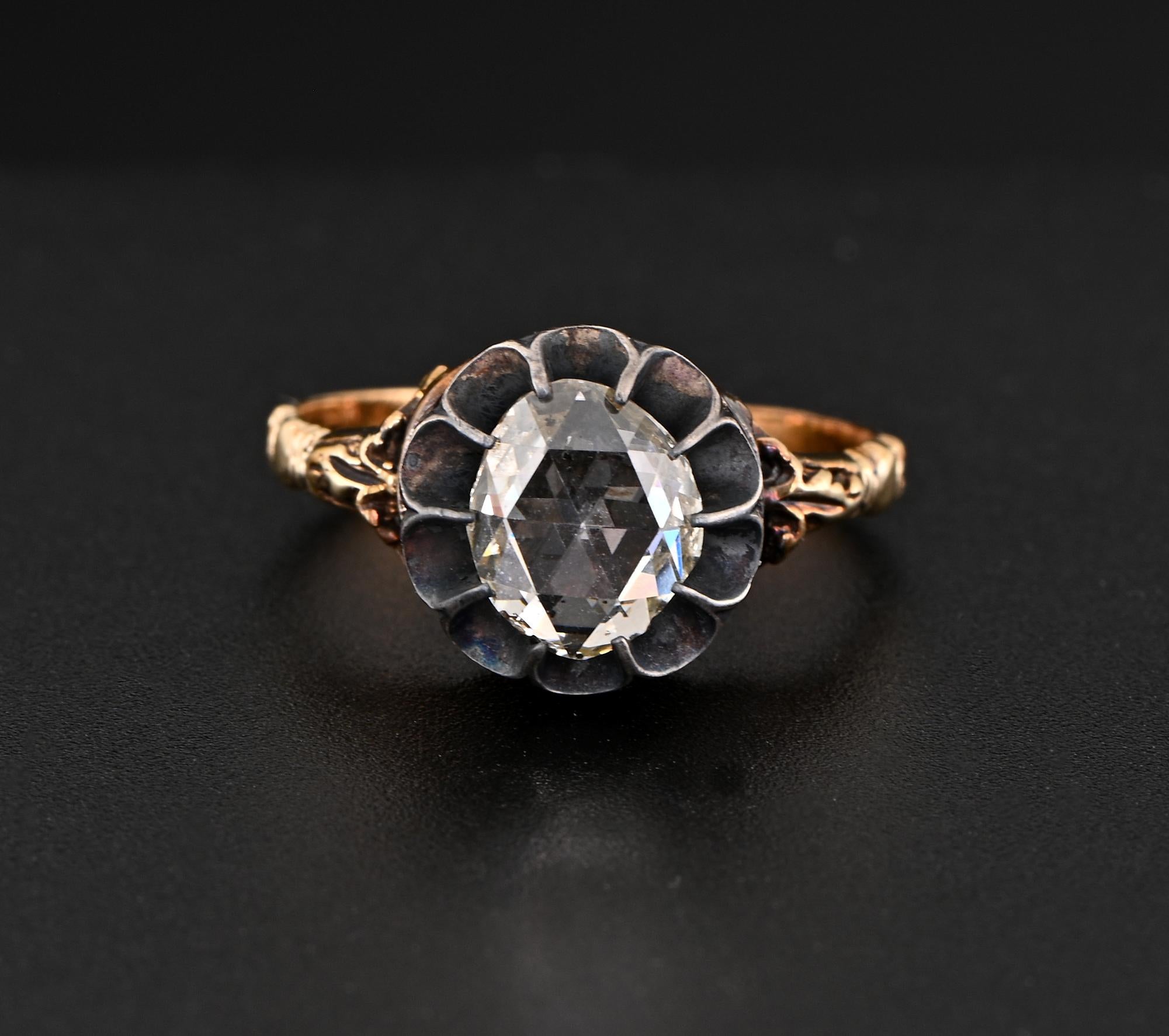 This amazing antique Diamond solitaire ring is 19th Century
Transitional between Georgian/ Victorian era, finely hand crafted at the time of solid 18 Kt gold with silver portions
Fascinating elaborate slim shank with gorgeous carved side details and