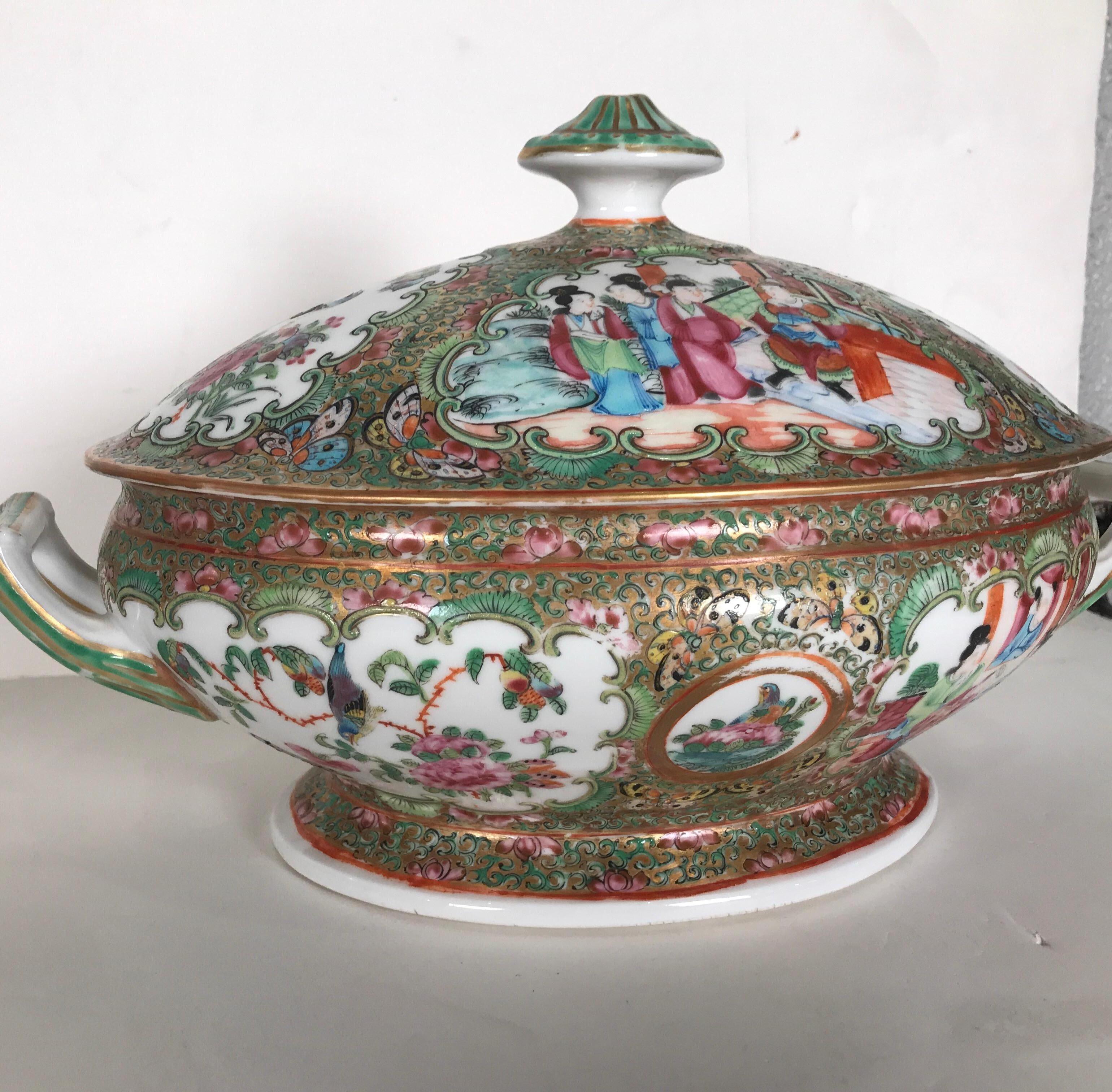 Exceptional quality mid-19th century Chinese export porcelain tureen. Hand painted all-over with typical robed figures, peonies and butterflies with a gilded background. The double handled form rests on a pedestal base and retains most of the