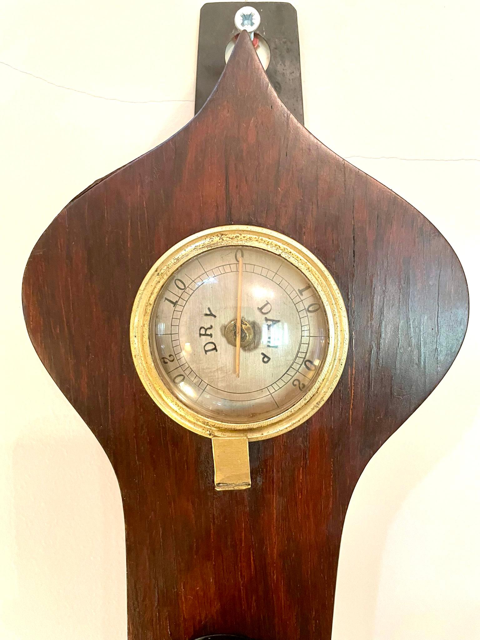 Antique 19th century rosewood banjo barometer having a quality rosewood case with a onion shaped top, nine inch silvered dial with original hands and thermometer, fitted hygrometer, glass fronted spirit level and a bone setting disc.

In lovely