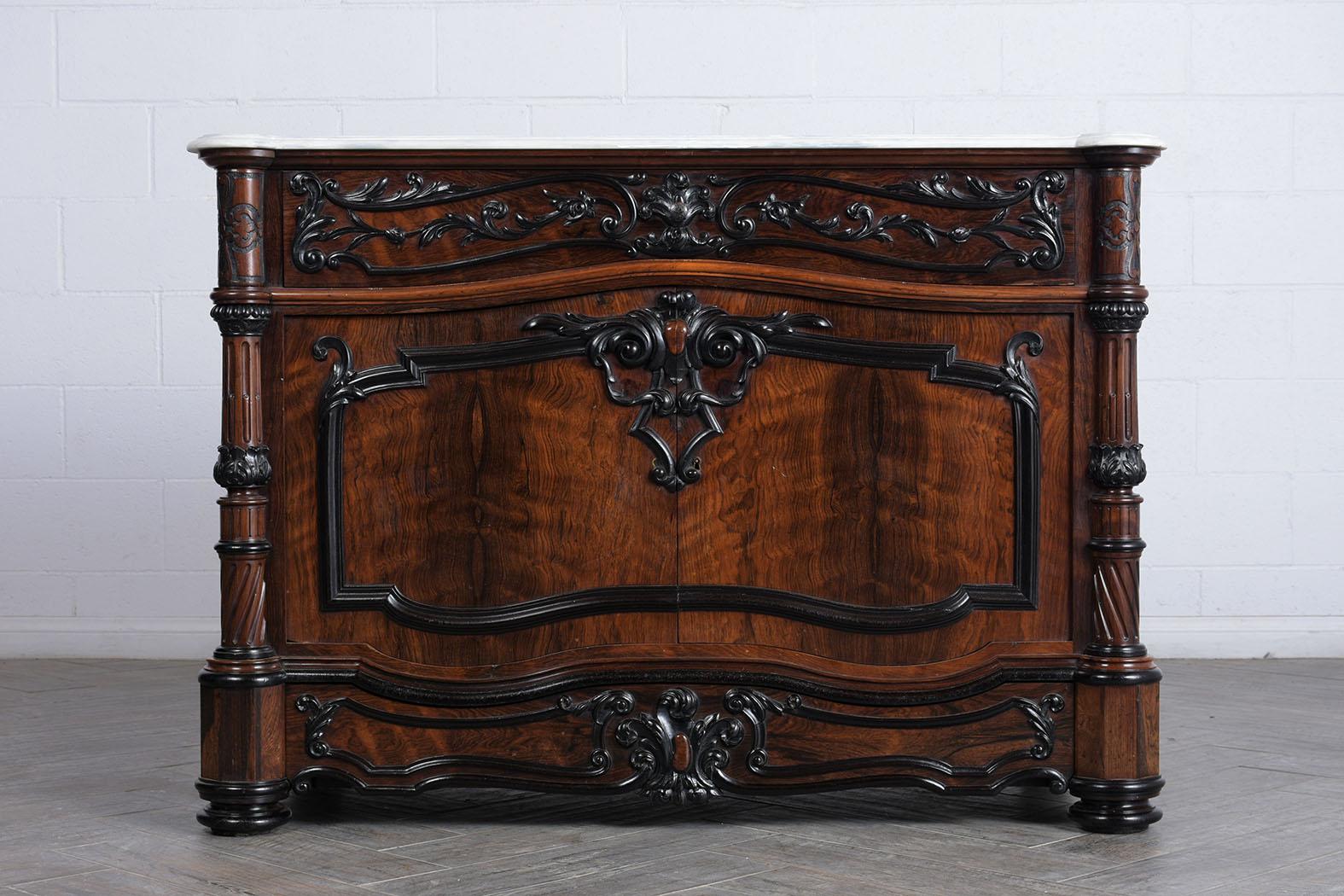 This Early 19th Century Regency Style Chest of Drawers is made out of solid rosewood and has its original mahogany & black color staining and has a newly lacquered finish. This antique dresser features a beveled white marble top, a large top drawer,