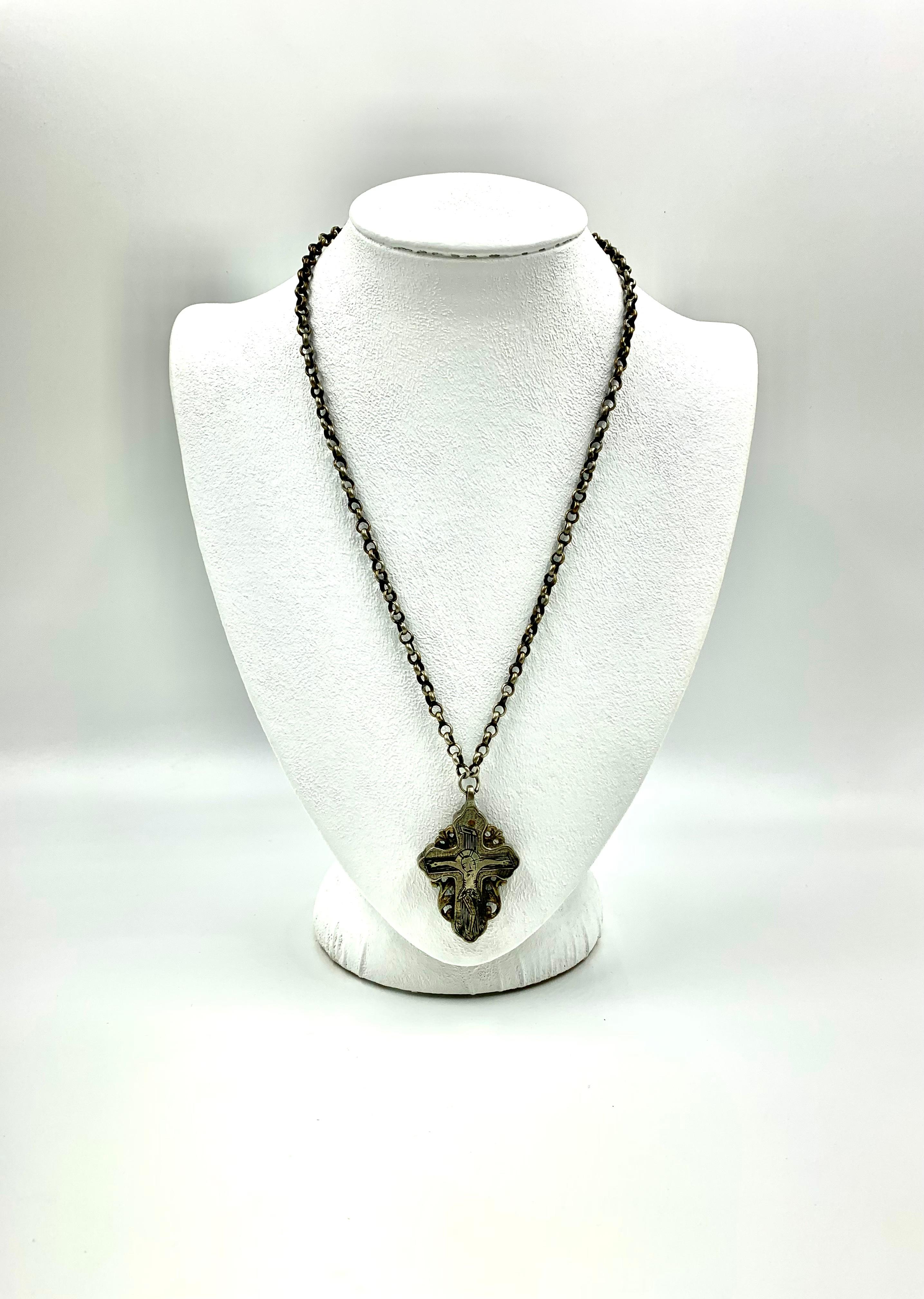 Antique Russian late 19th century silver and niello double sided reliquary cross on period long chain
This beautiful antique Russian reliquary cross depicts Christ in a distinctive naive style seen in Russia at the end of the Seventeenth and